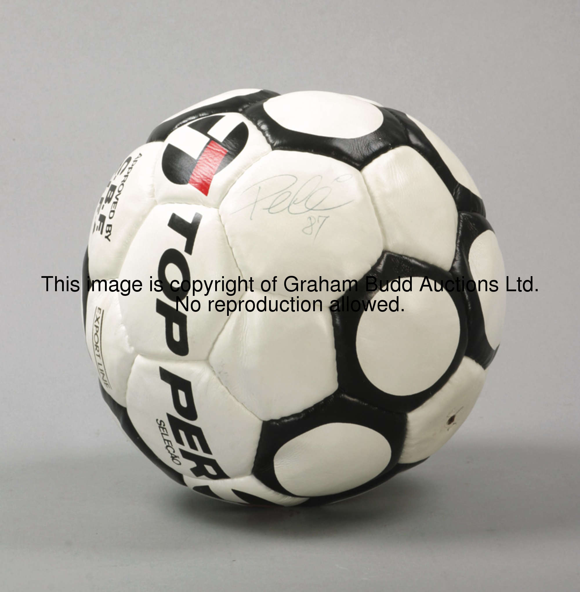 A football signed by Pele, the ball by Topper, signed in blue pen & dated '87  This ball was signed ...