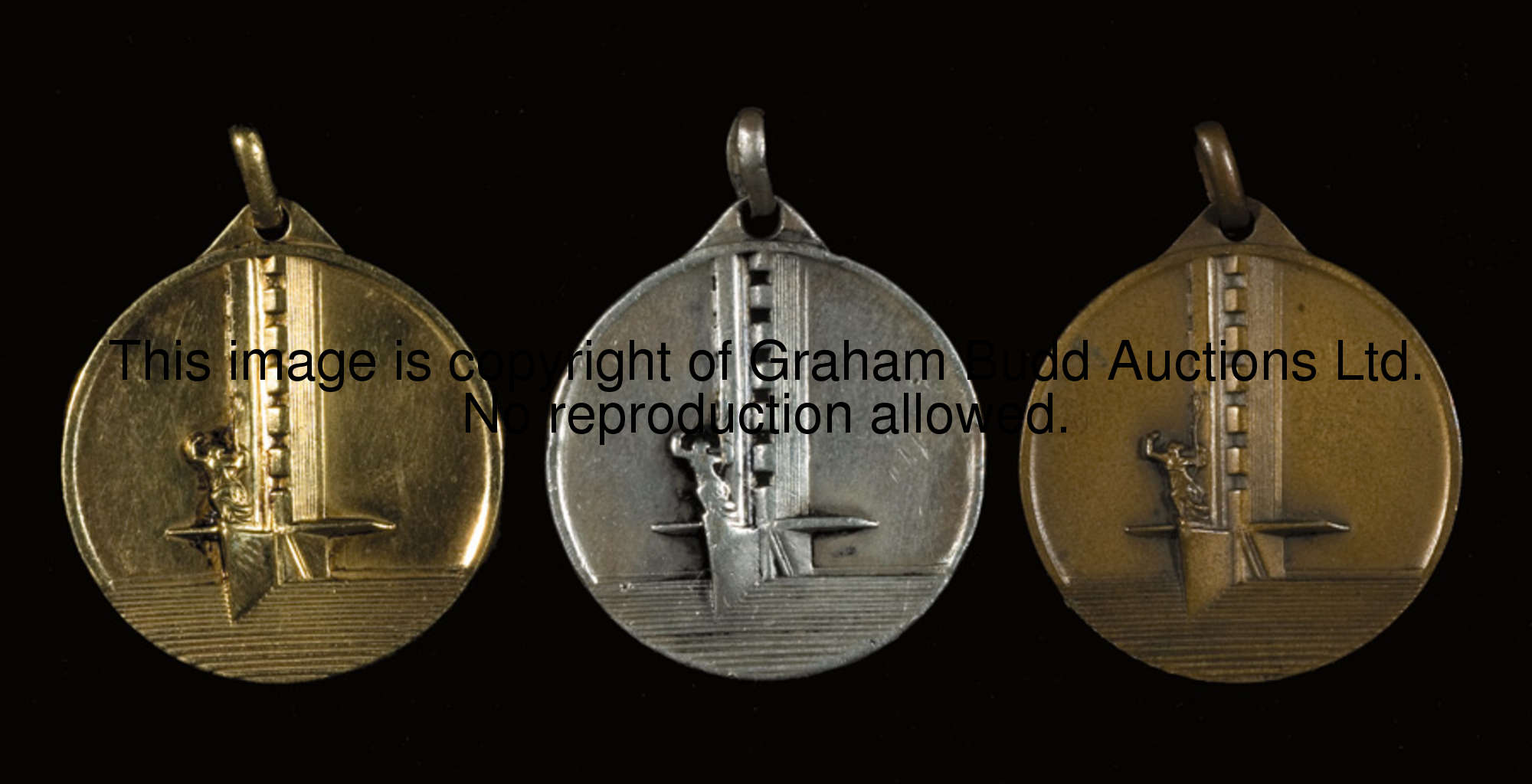 A set of 'gold', silver & bronze medals from the 1930 World Cup in Uruguay, each struck with a view ...