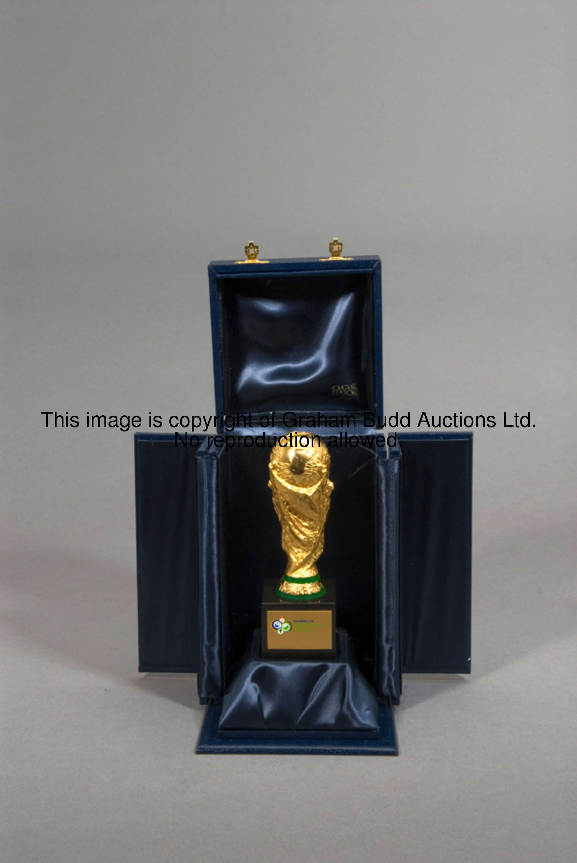 A miniature replica of the World Cup trophy presented by FIFA to