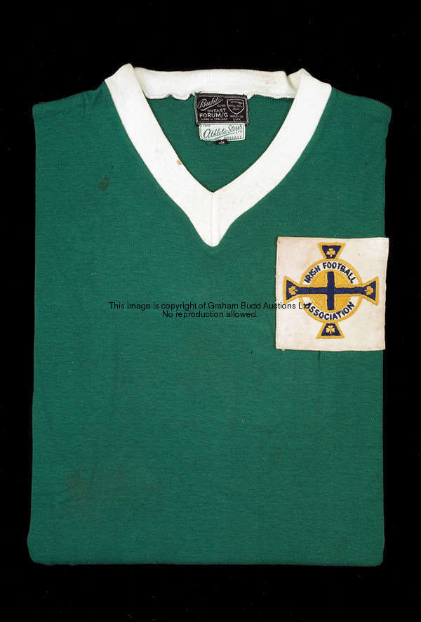 'Eddie' Magill: a green Northern Ireland No.2 international jersey, short-sleeved, white v-neck coll...