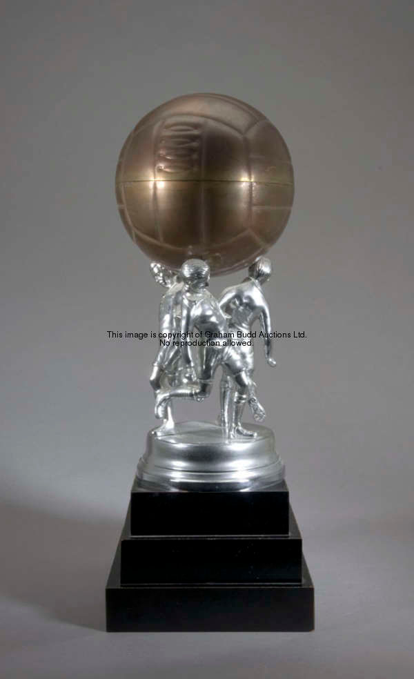 An elaborate 1930s football trophy, with three chromed footballers supporting a metal football that ...