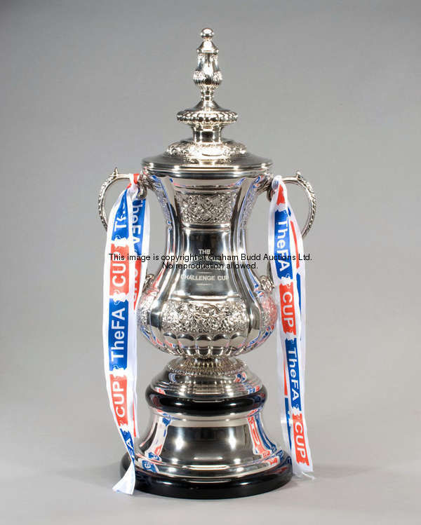 A full-size silver plated replica of the Football Association Challenge Cup Trophy, the two-handled ...