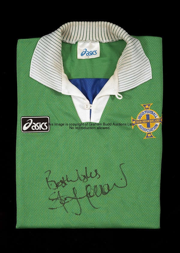 Steve Morrow: a signed green Northern Ireland No.2 jersey, signed Best Wishes in black marker pen, s...