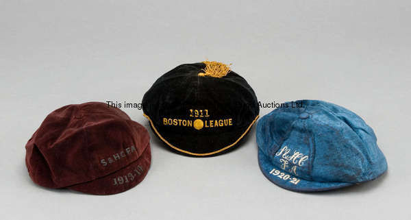 Three representative football caps awarded to Stan Fazackerley, comprising a black and gold cap insc...