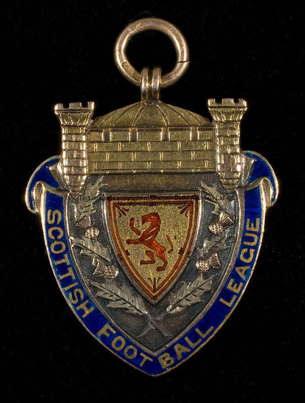 A 15ct. gold and enamel Championship medal from the very first season of Scottish League Football in...