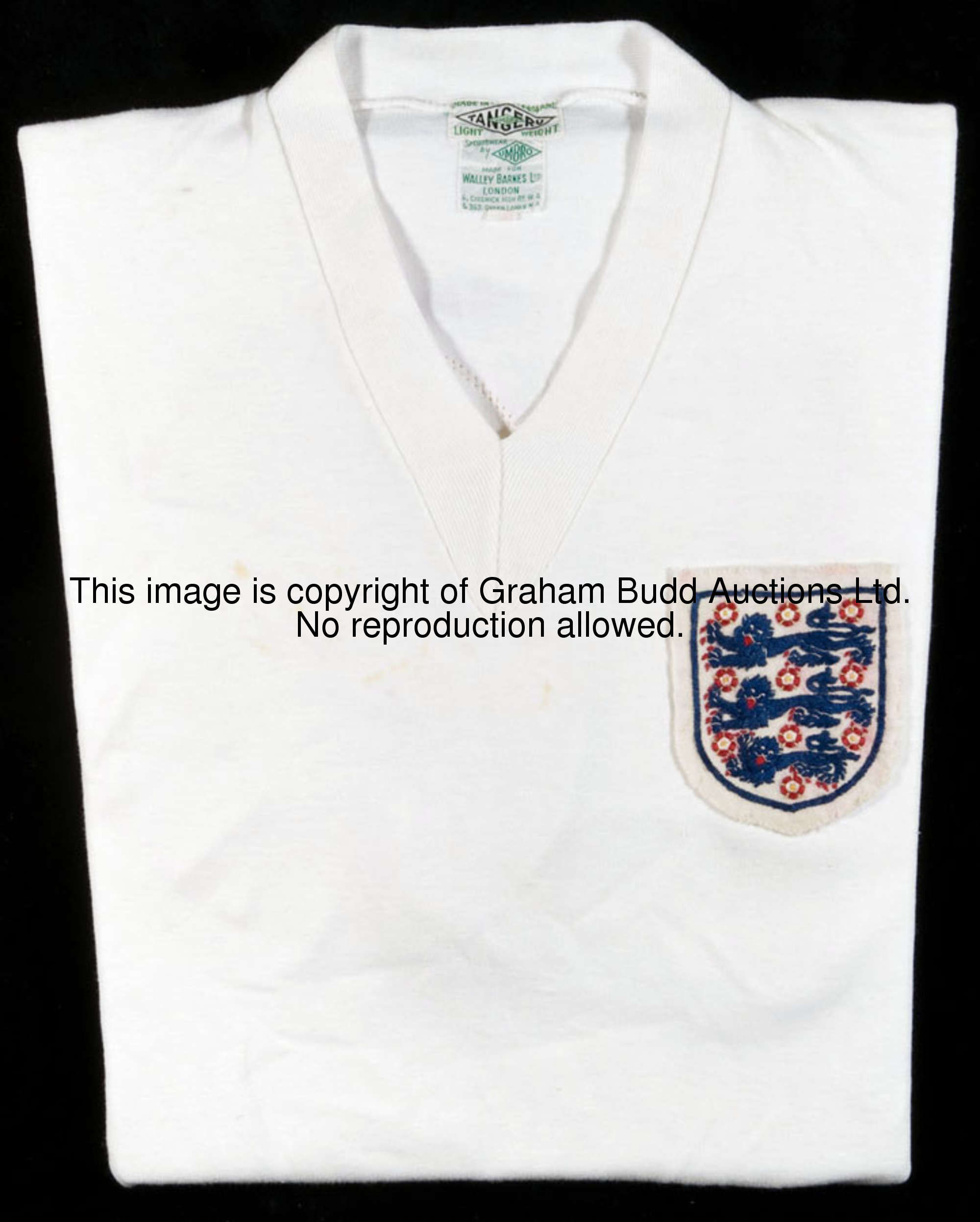 A Maurice Norman white England No.16 1958 World Cup jersey, short-sleeved, v-neck, embroidered badge...