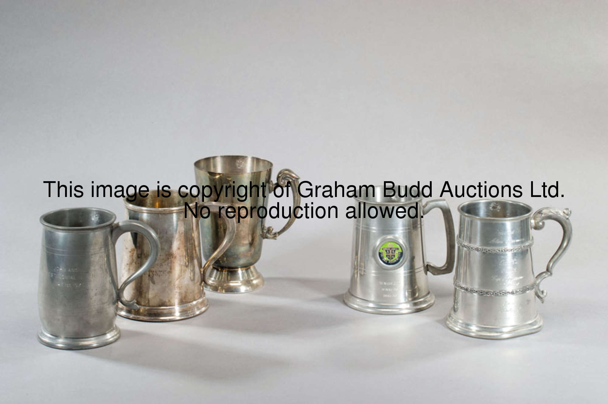 A group of three pint tankards awarded to Burnley's Alan Stevenson, the first two silver plated, the...