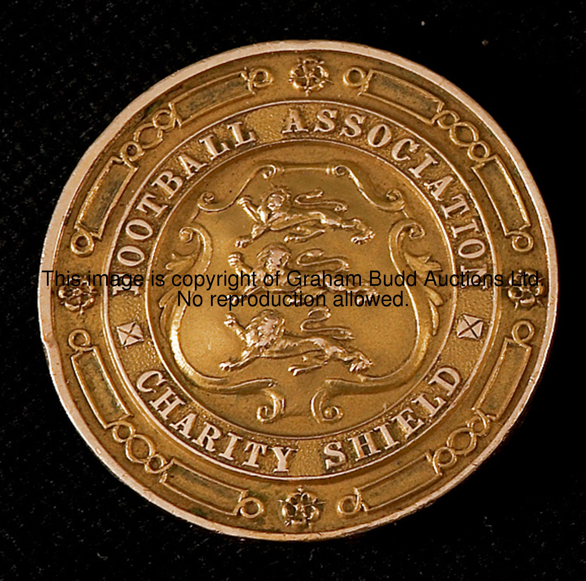 A 9ct. gold F.A. Charity Shield medal 1920, inscribed FOOTBALL ASSOCIATION CHARITY SHIELD  The rever...