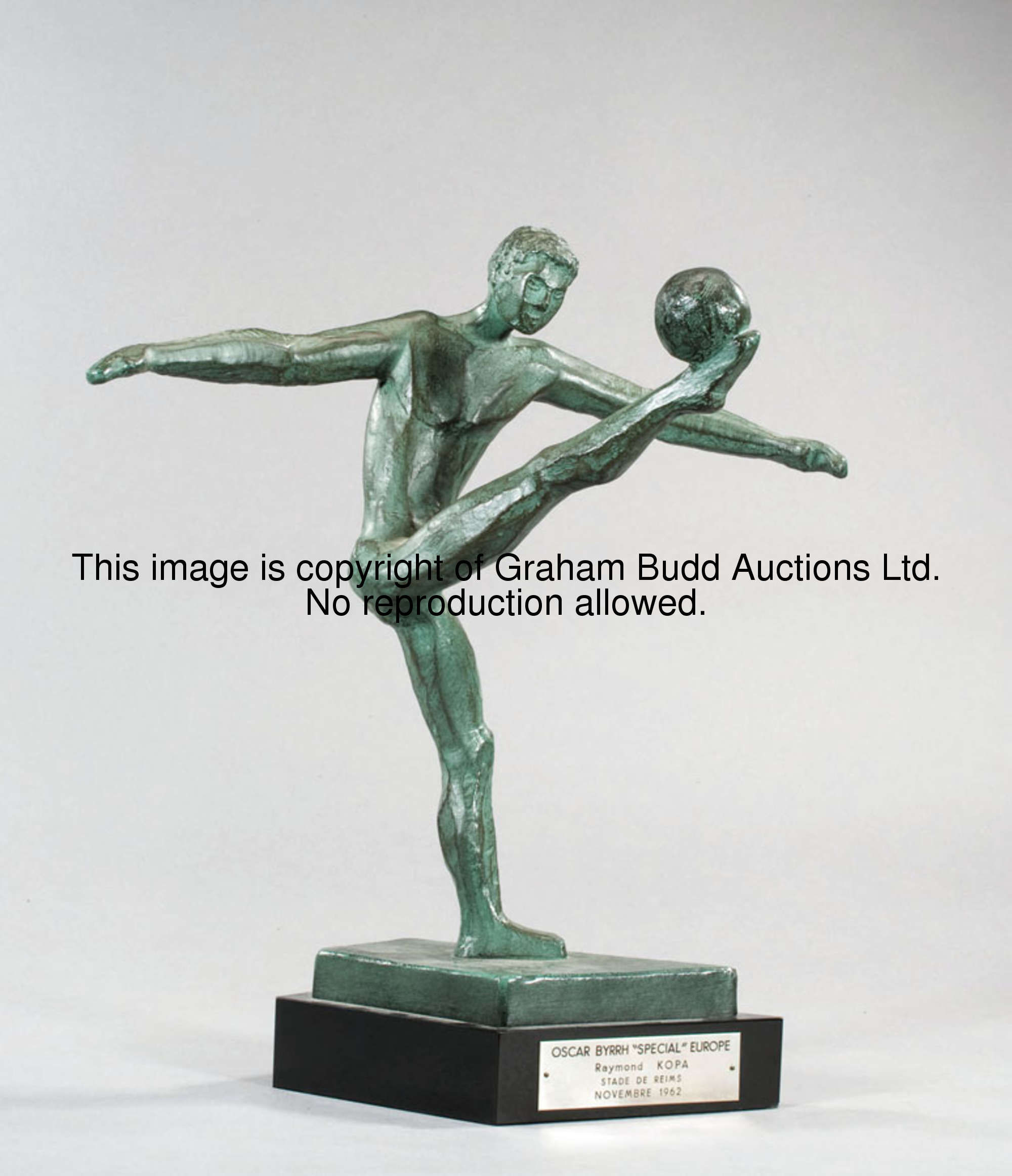 A 1962 presentation to Raymond Kopa, in the form of a green spelter sculpture of a footballer, mount...