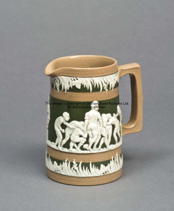 A small Copeland late Spode stoneware jug, with rugby scenes moulded in white raised relief between ...