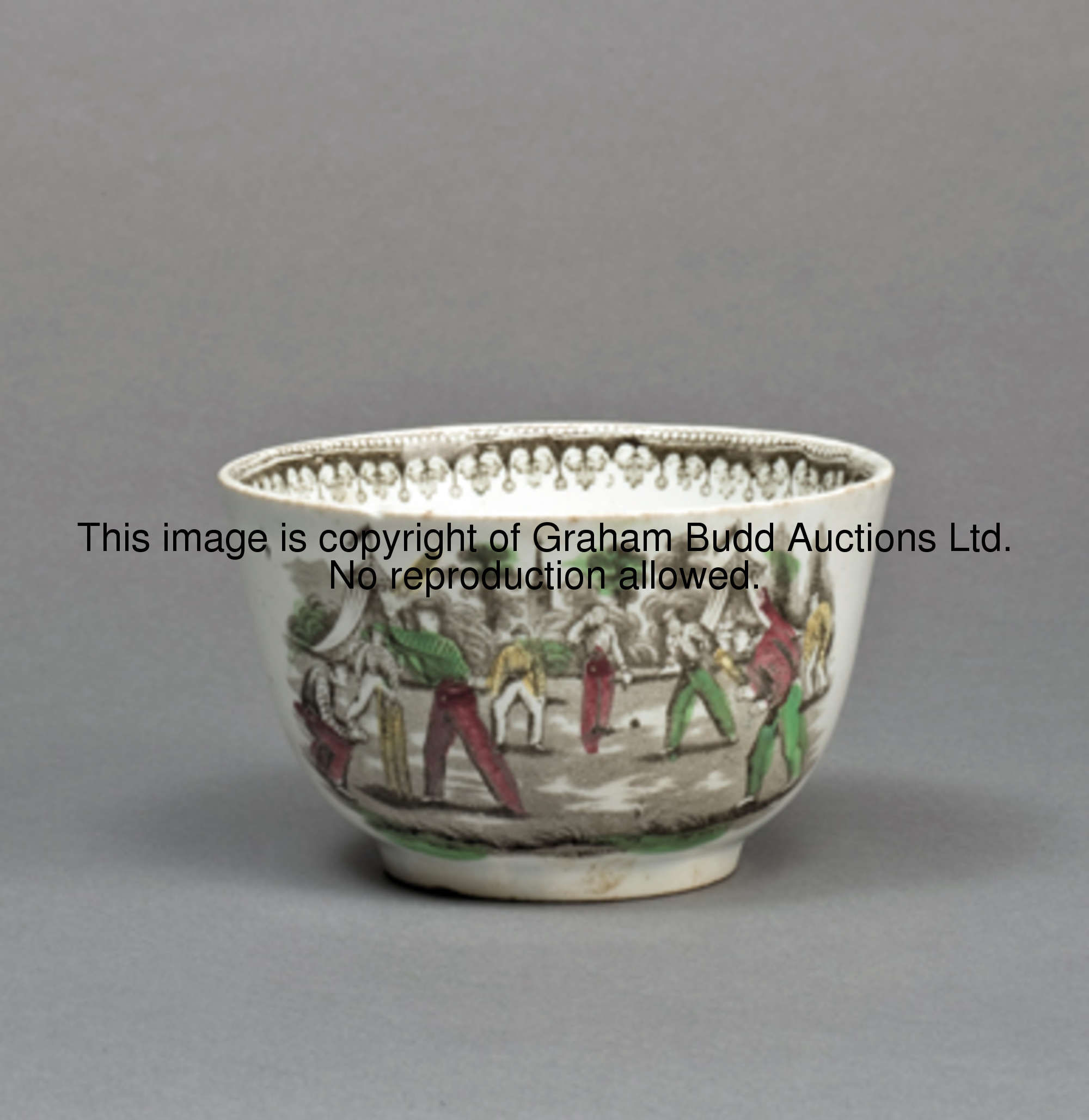 A Victorian Staffordshire bowl, printed in colours with a repeated design of a cricket match with te...