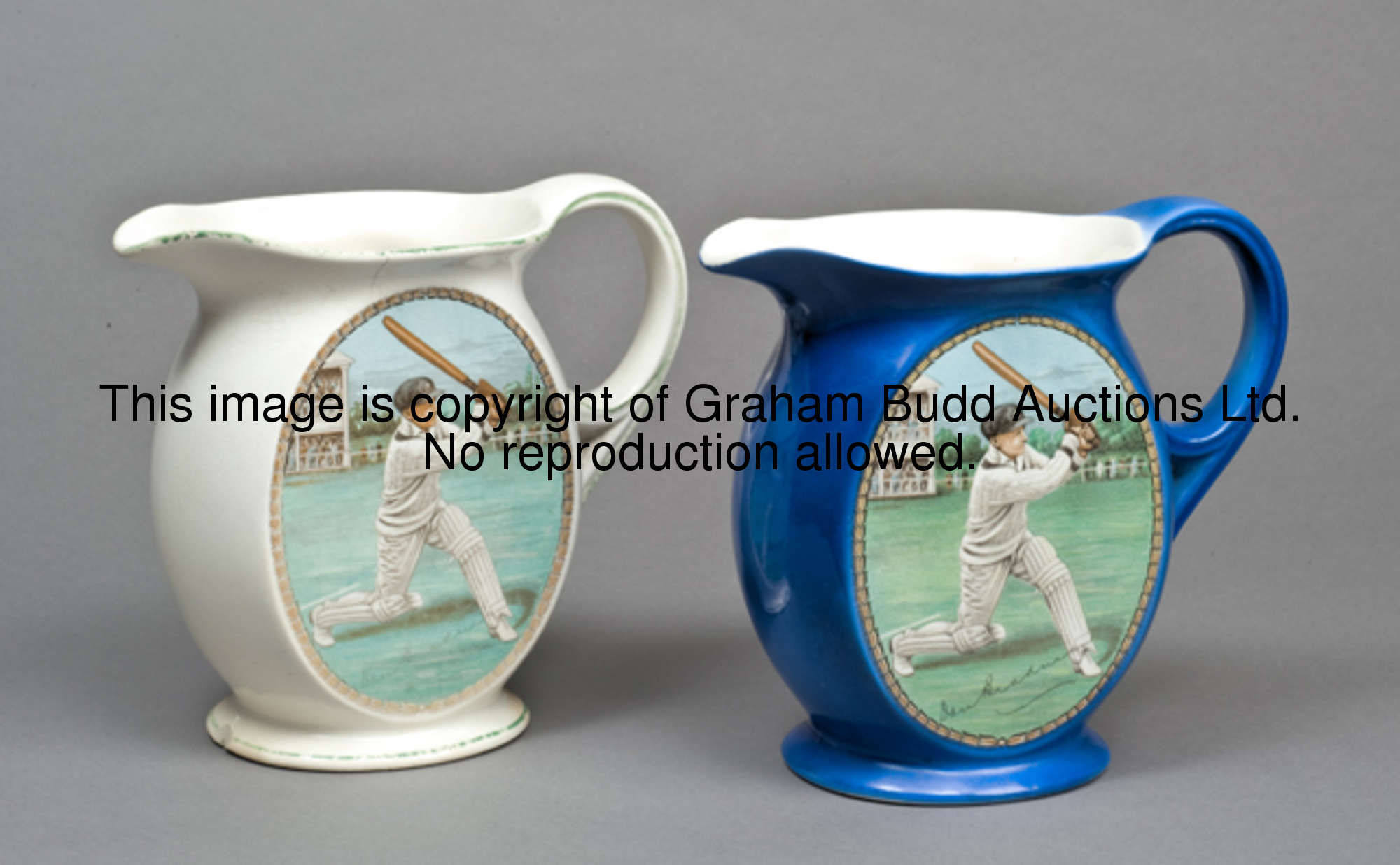 Two New Hall Pottery Staffordshire water jugs, both featuring an oval portrait of Don Bradman with p...