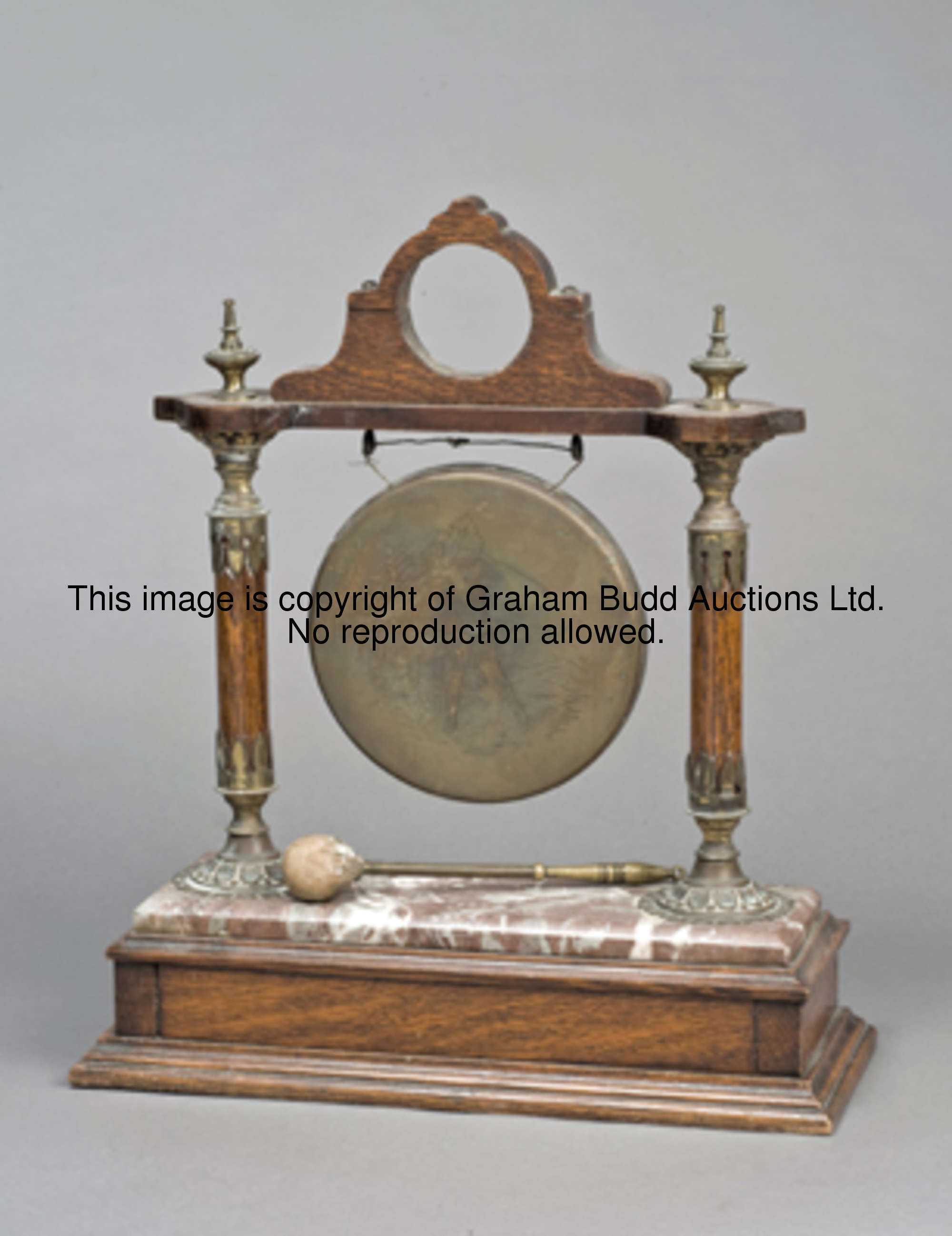 A golf club dinner gong circa 1900, the brass gong engraved with a gentleman golfer at the top of hi...
