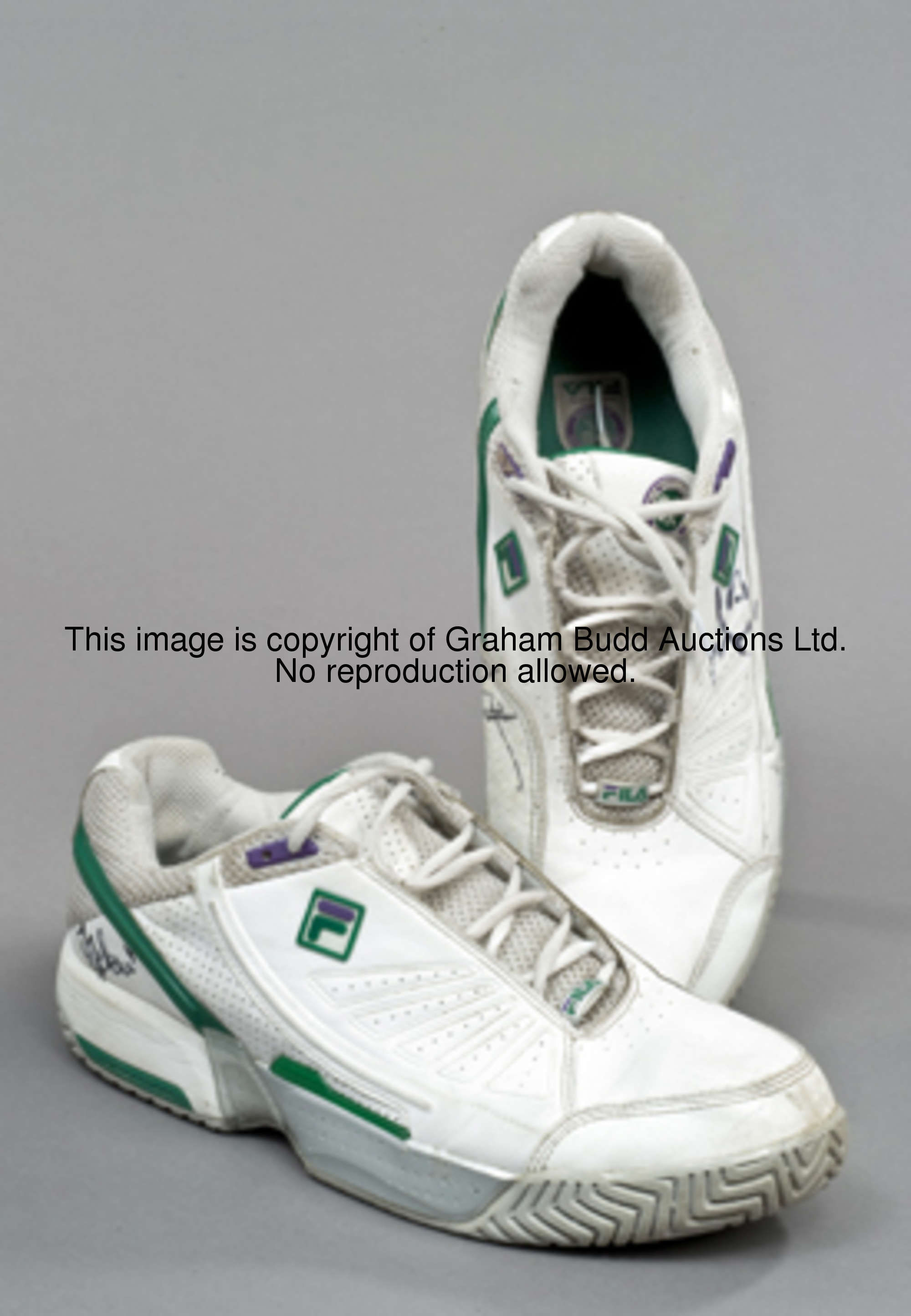 A pair of Fila Wimbledon Championship tennis shoes signed at the 2008 Wimbledon championships by Rog...