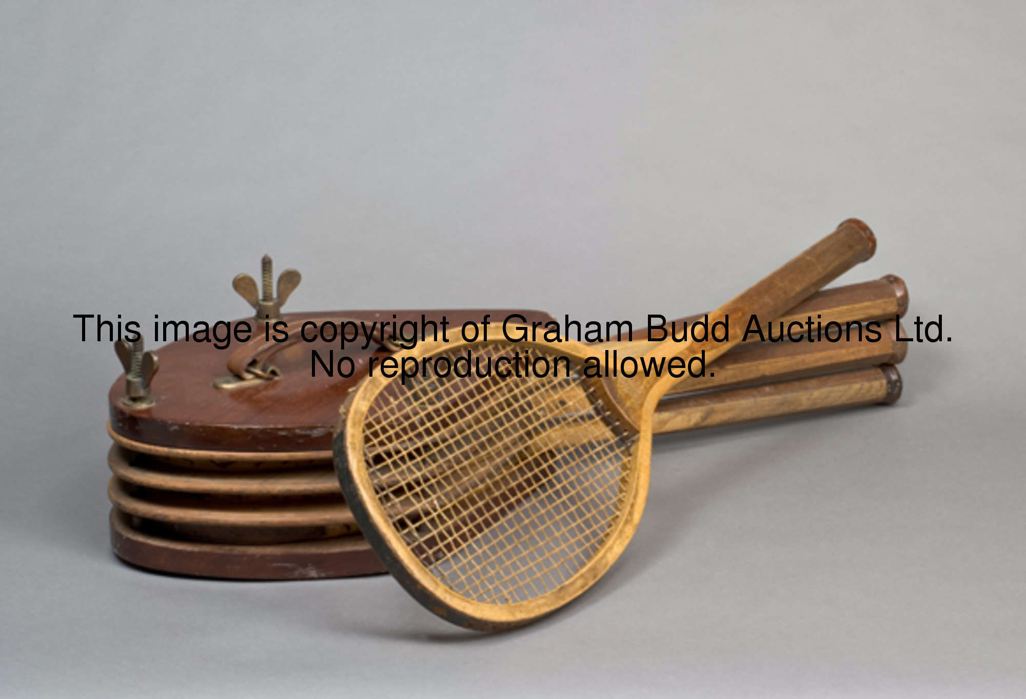 A near-set of four 'College' lawn tennis rackets probably by George Bussey of London circa 1900, the...