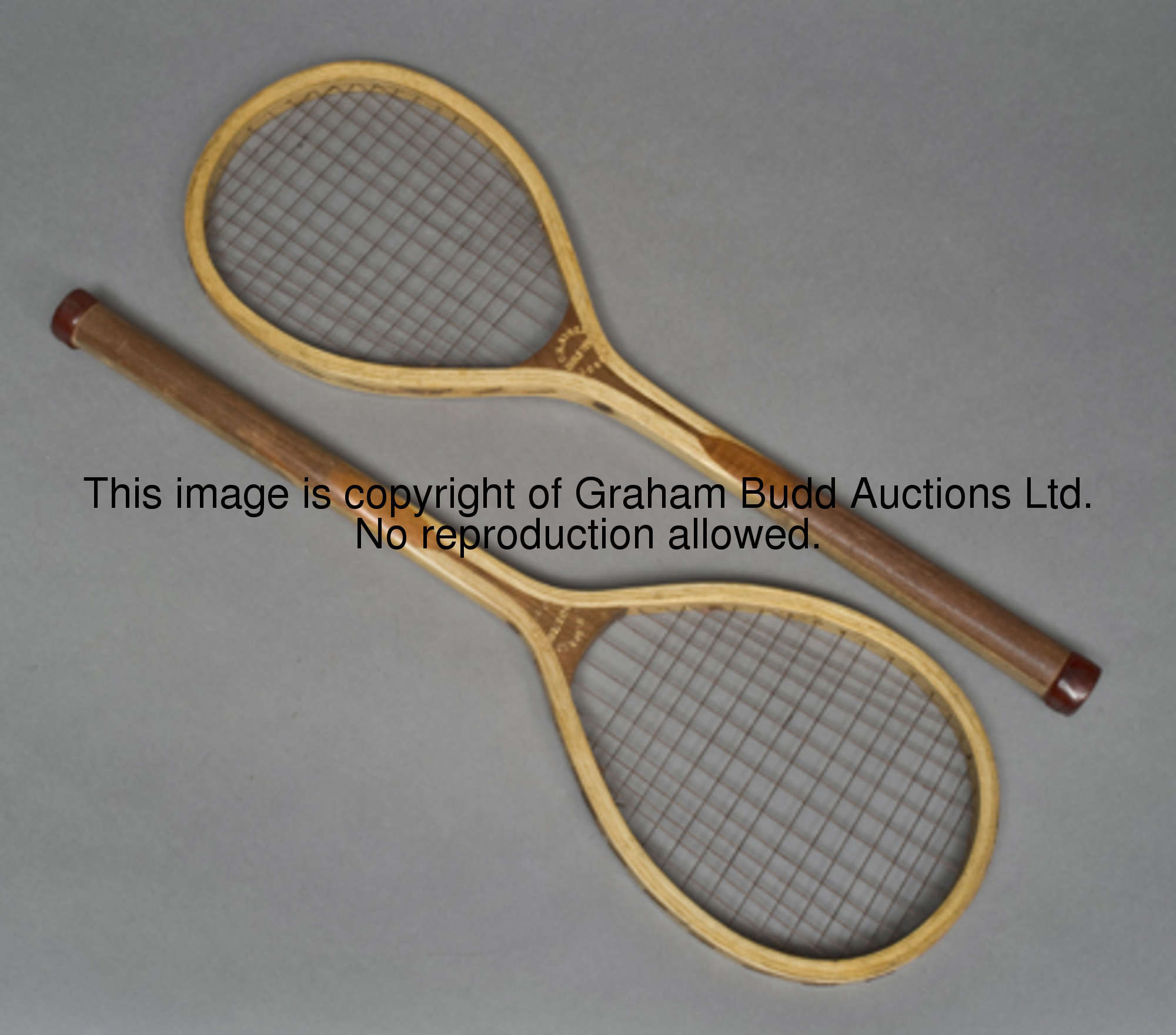 A rare pair of F.H. Ayres strung table tennis racquets circa 1900, with original leather butt caps