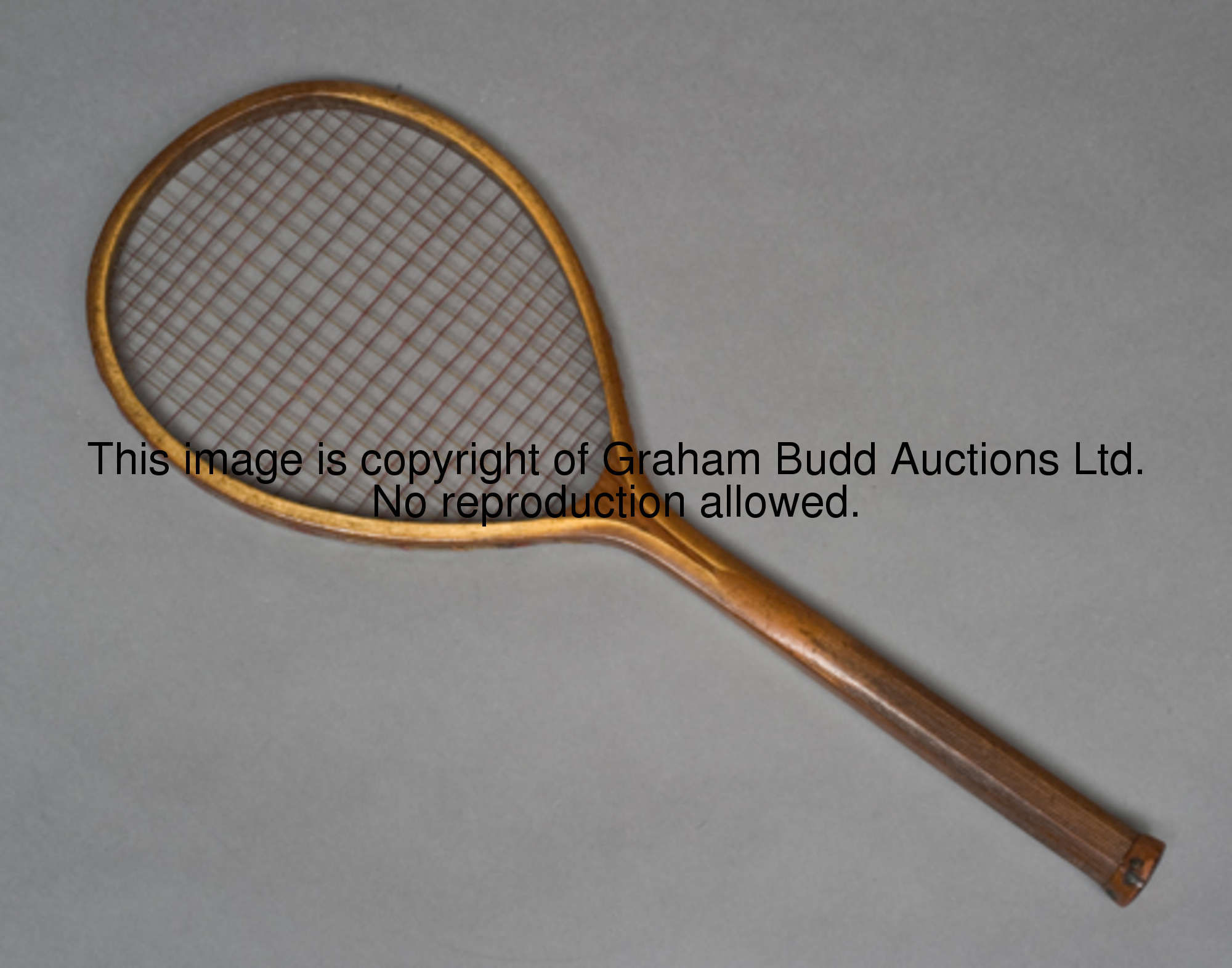 A rare teardrop-shaped strung table tennis racquet circa 1890s, two-tone gut strings, leather butt c...