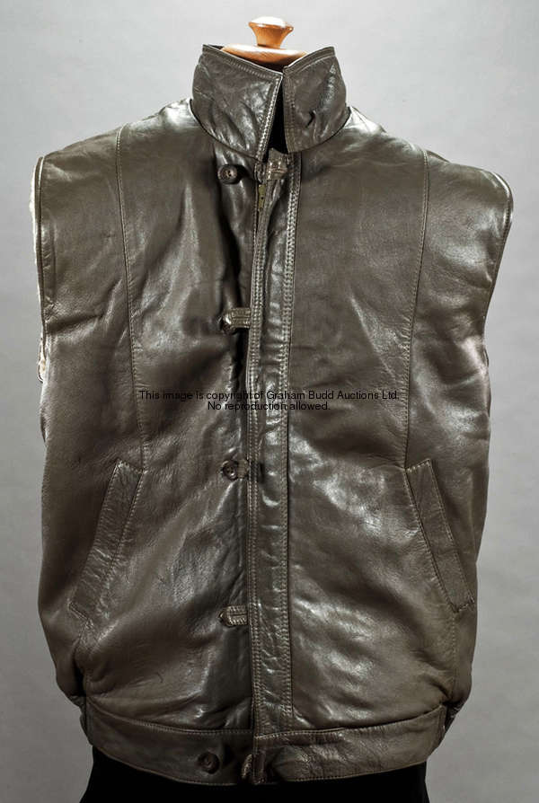 George Best's sleeveless leather jacket by Dunhill of London 1980s, with sheepskin lining; sold with...