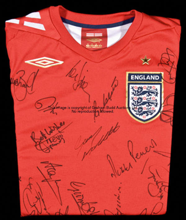 A multi-signed red England replica jersey, 33 signatures of England players past an present in black...