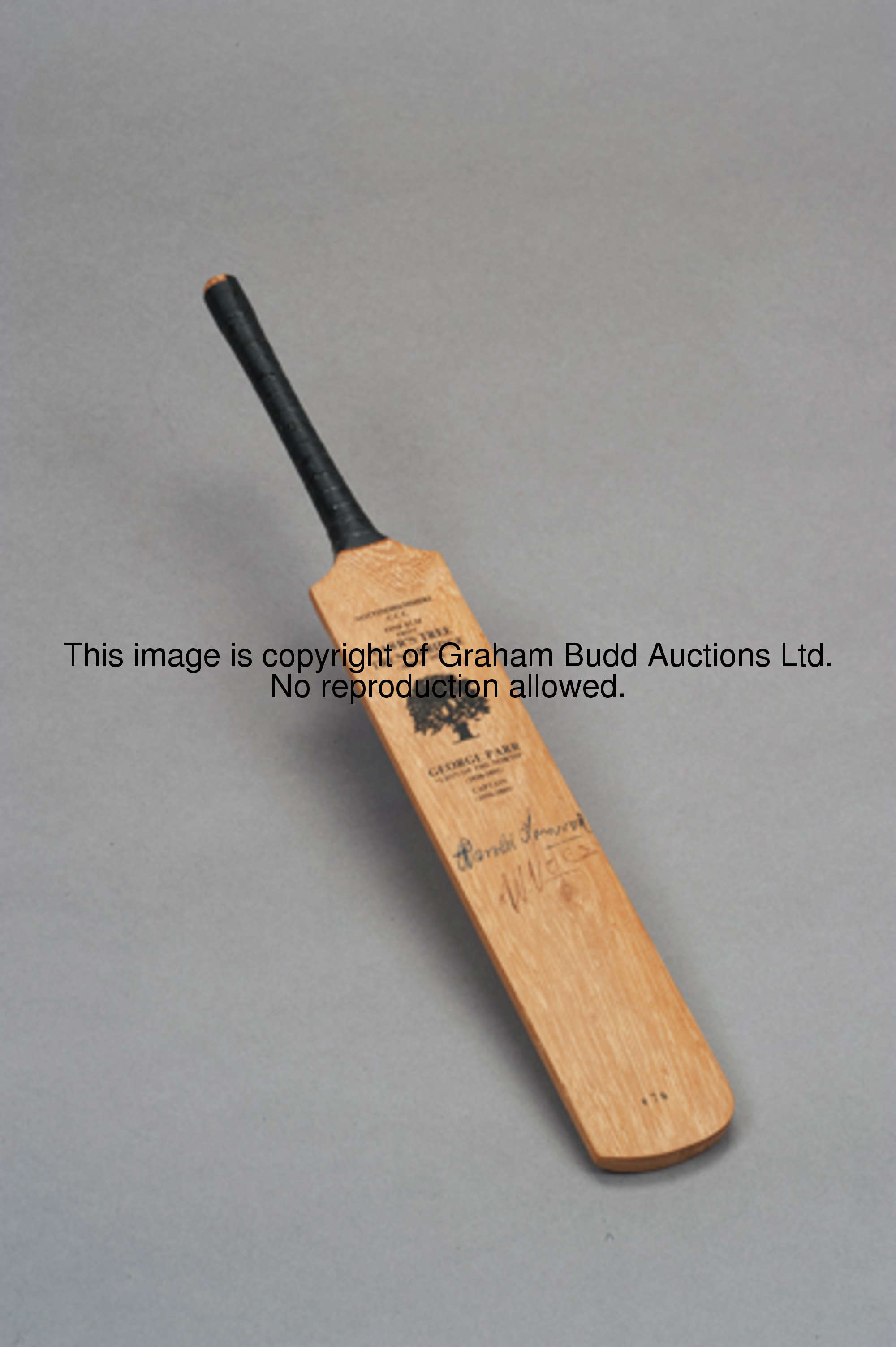 A miniature cricket bat made of elm from 'Parr's Tree' at Trent Bridge and signed on the face by the...