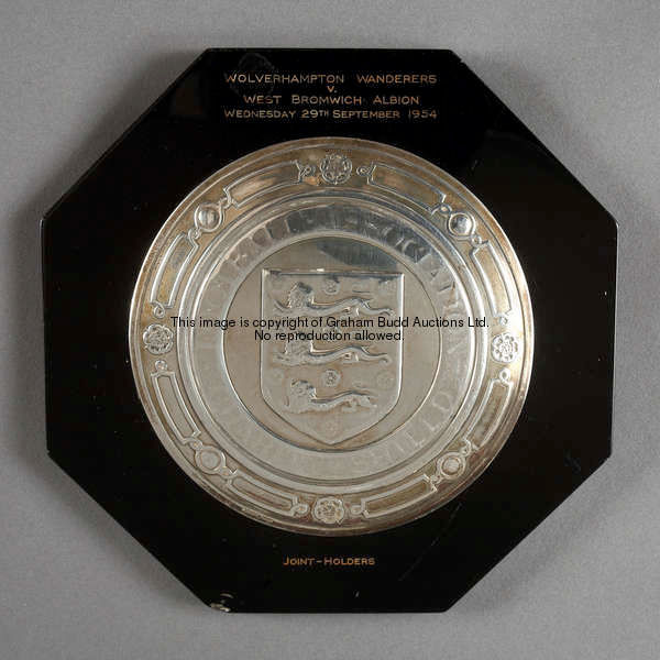 A silver miniature replica of the F.A. Charity Shield presented to West Bromwich Albion's Len Millar...