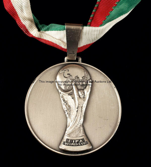 A 1990 FIFA World Cup runners-up medal, in continental silver by Huguenin, the obverse with the Worl...