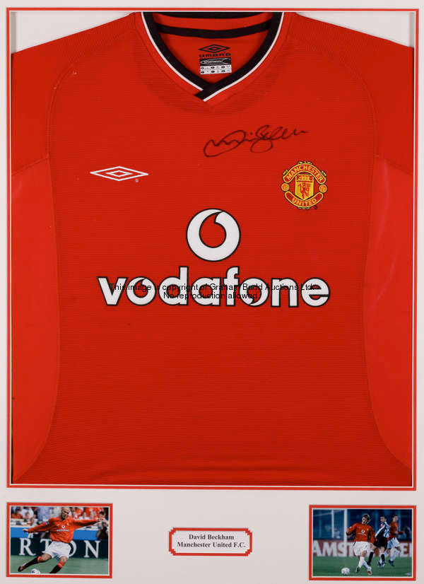 A signed David Beckham display, mounted ready for framing and comprising a signed red replica Manche...