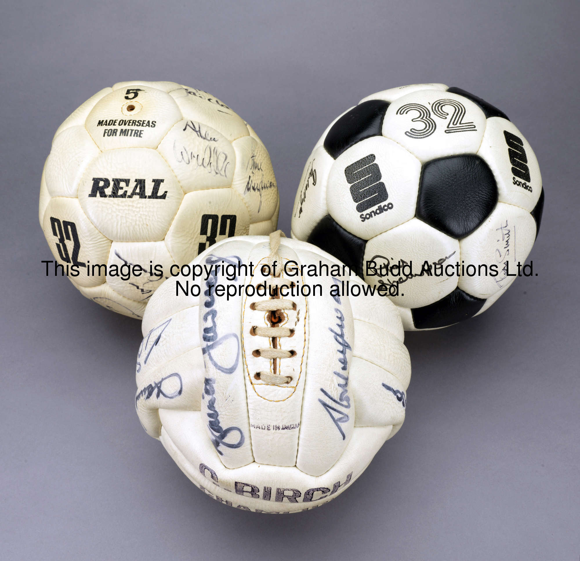 A trio of signed Liverpool footballs signed by teams from the Bob Paisley era