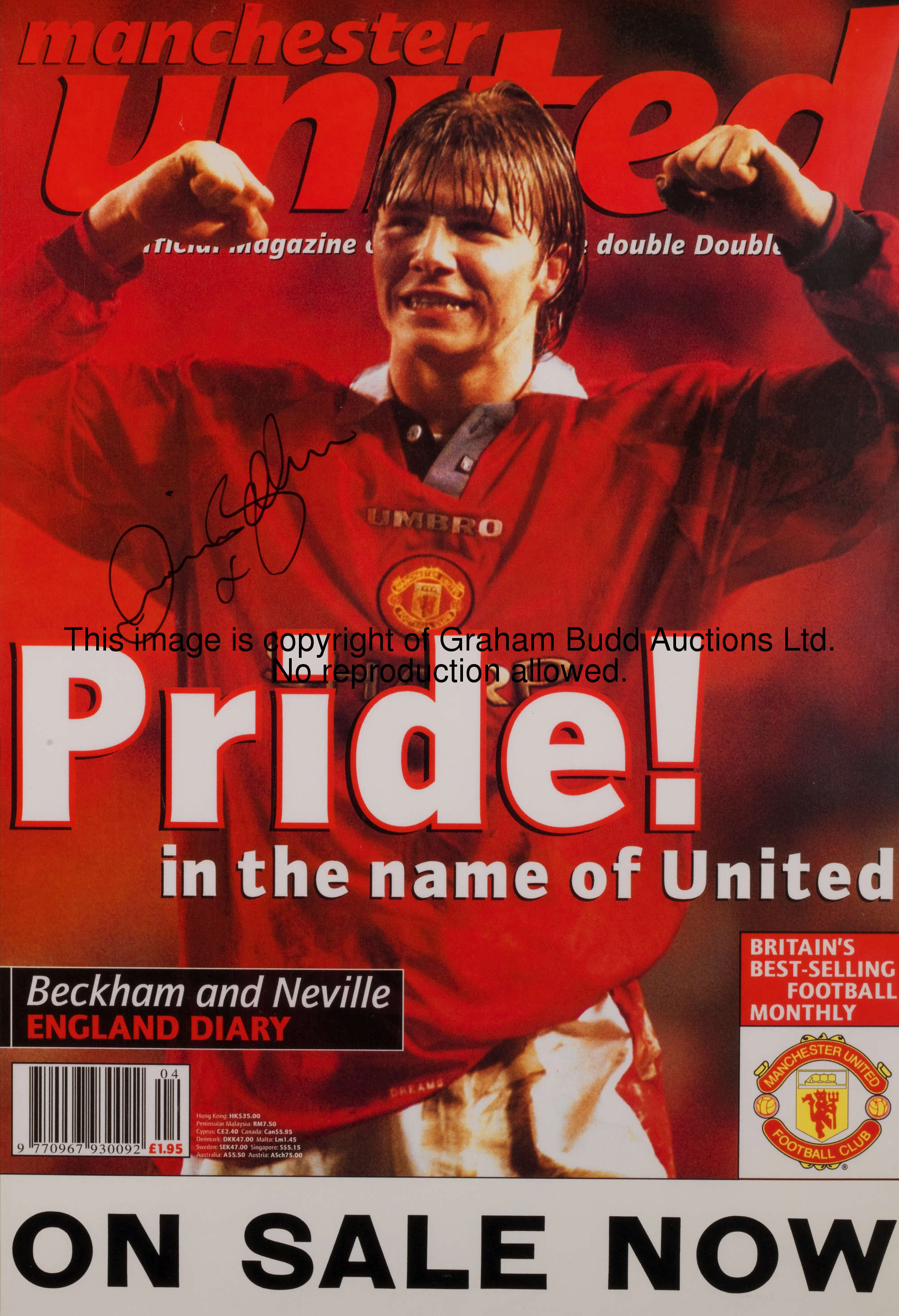 A Manchester United magazine poster featuring and signed by David Beckham, signature in black marker...