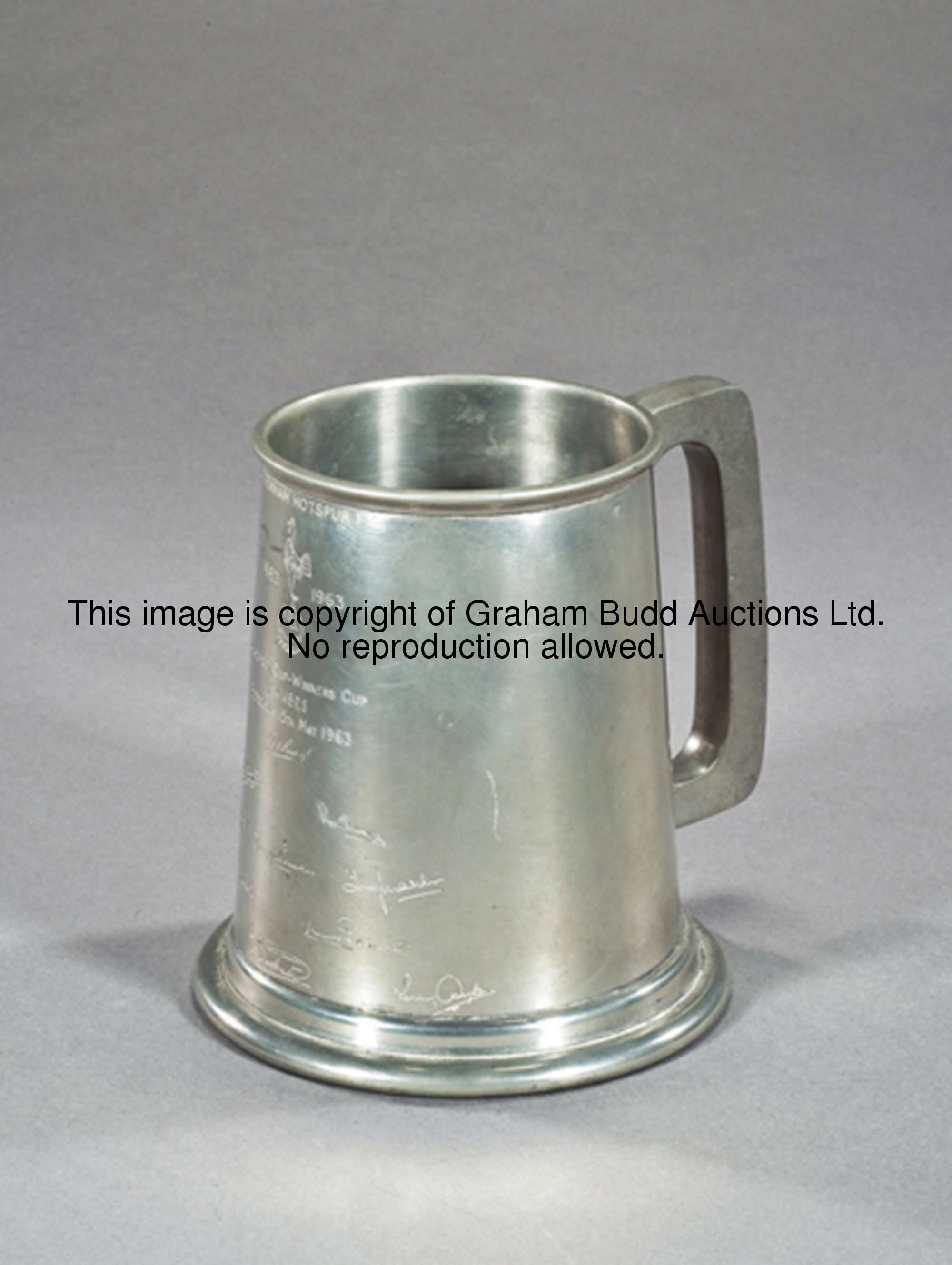 A pewter tankard commemorating Tottenham Hotspur's European Cup Winners' Cup victory in 1963, inscri...