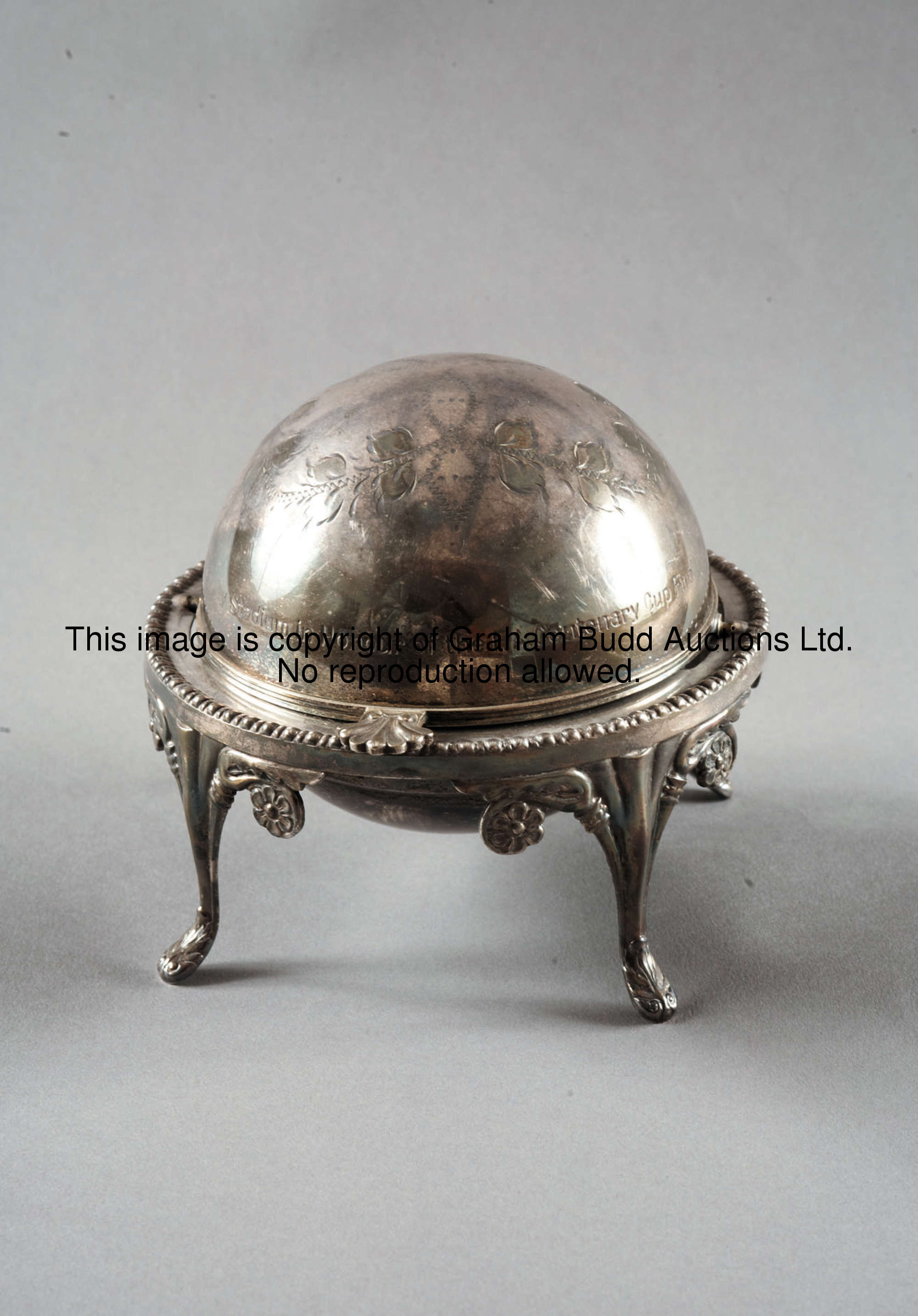 A silver plated butter dish with revolving lid from the Wembley Stadium luncheon before the centenar...