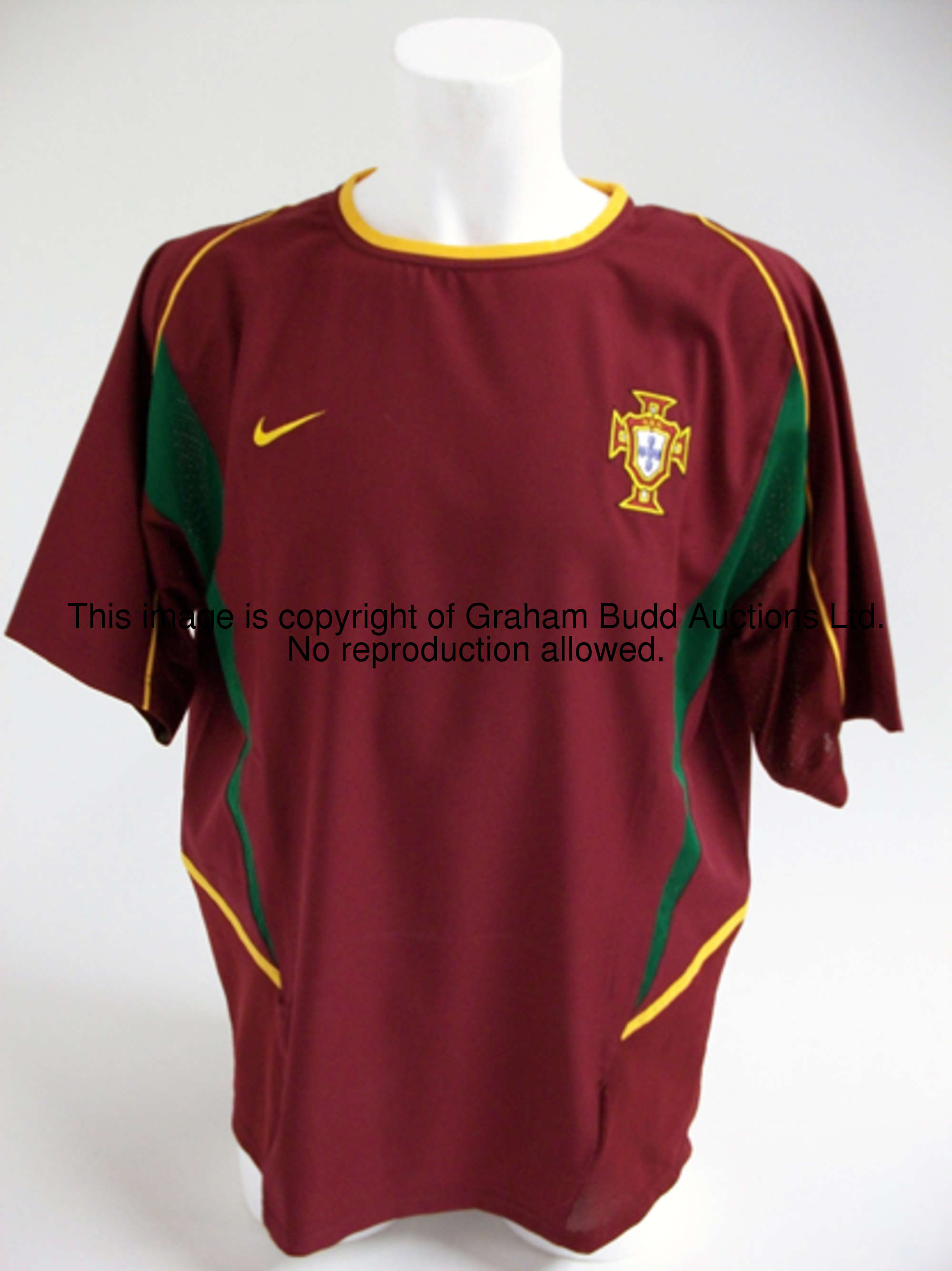 Luis Figo: a maroon Portugal No.7 international friendly jersey circa 2002, short-sleeved, the rever...