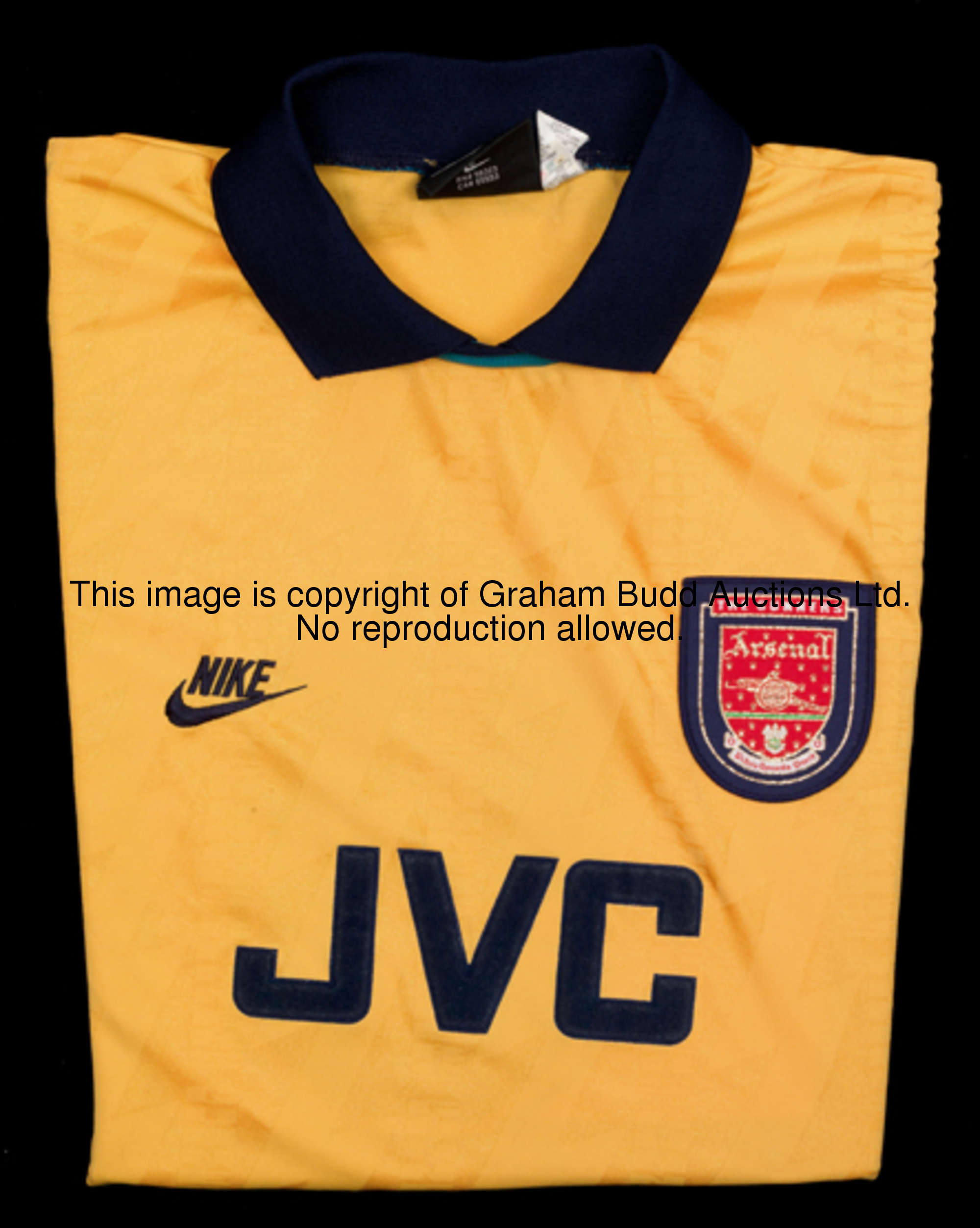 The yellow & blue Arsenal third choice jersey from season 1994-95, this example a short-sleeved No.9...