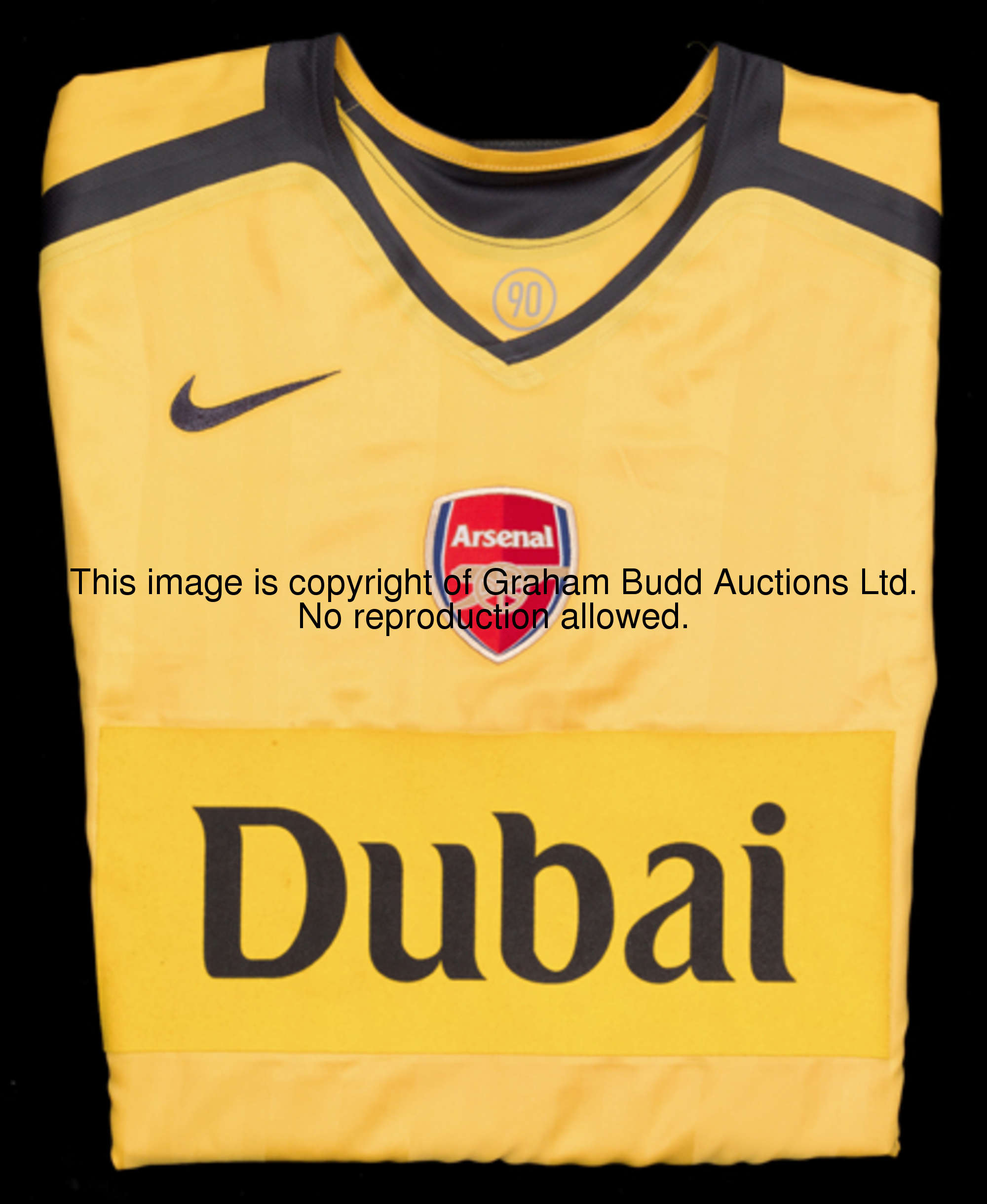 Emmanuel Adebayor: a yellow Arsenal No.25 ''Dubai'' Champions League jersey from the match in Hambur...