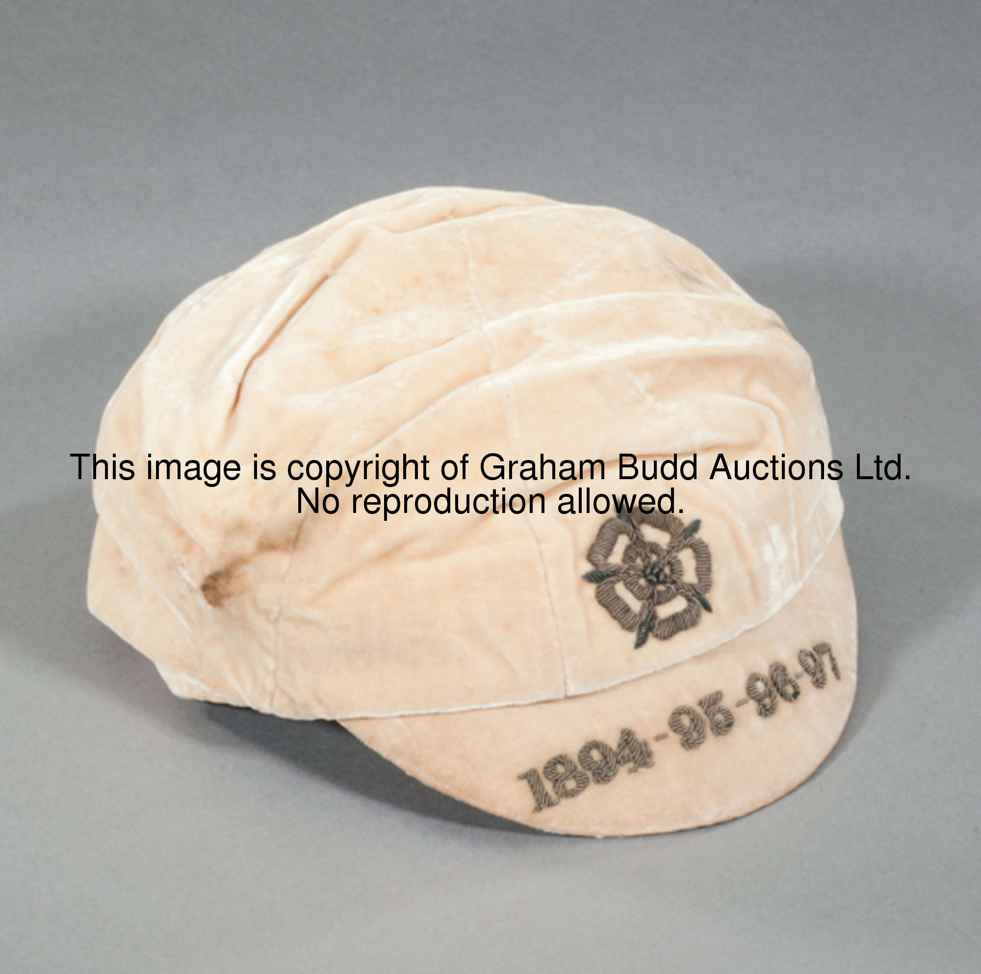 John Goodall's white England v Ireland international cap 1894-1897, inscribed in silver wire 1894-95...