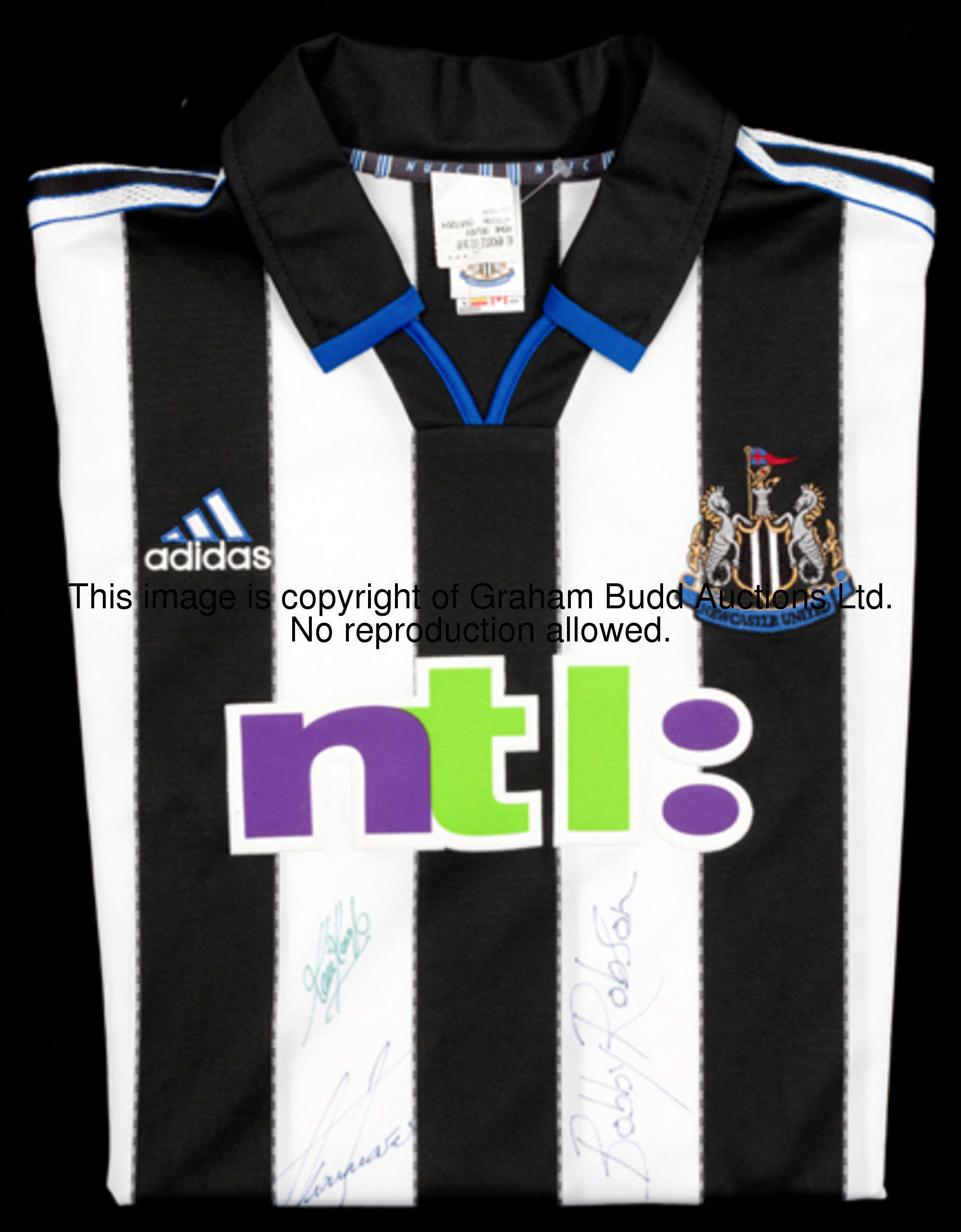A replica Newcastle United jersey signed by club legends Bobby Robson