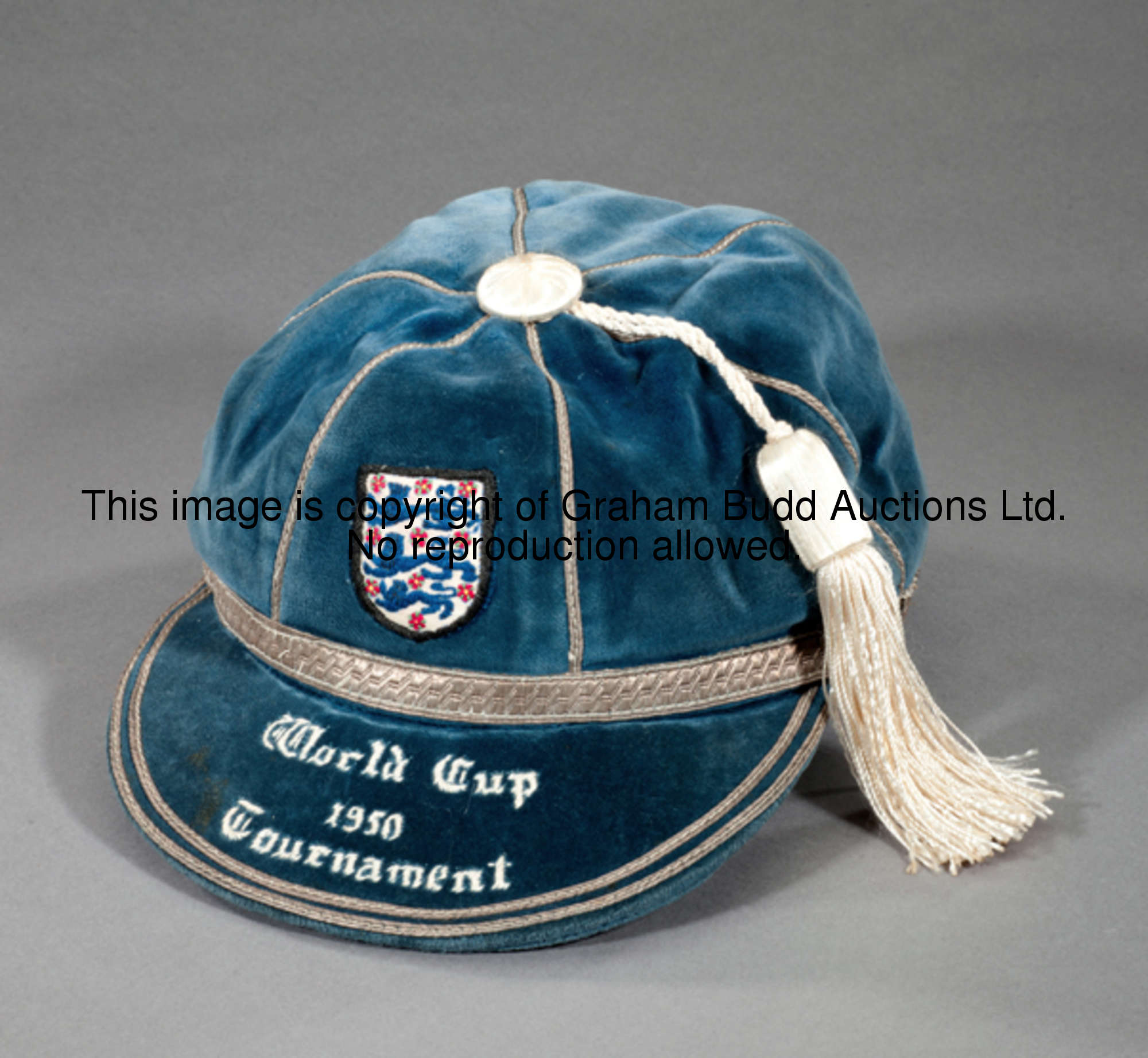 A blue England 1950 World Cup Tournament cap, inscribed WORLD CUP, 1950, TOURNAMENT; sold together w...