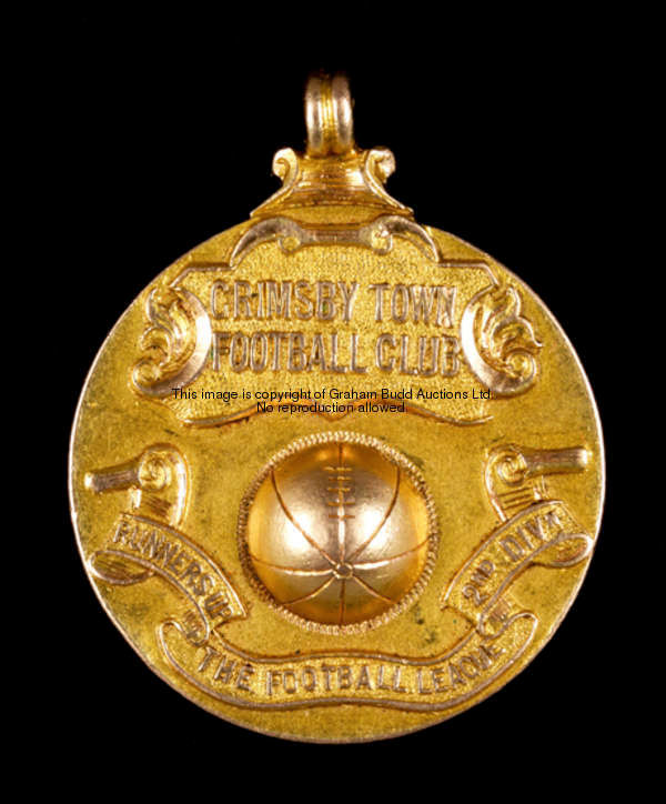 A 15ct. gold medal commemorating Grimsby Town's promotion to the First Division in season 1928-29 an...