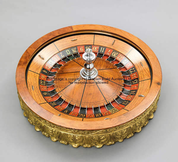 An antique American roulette wheel by Mason and Co. of Newark, New Jersey circa 1900 red & black slo...