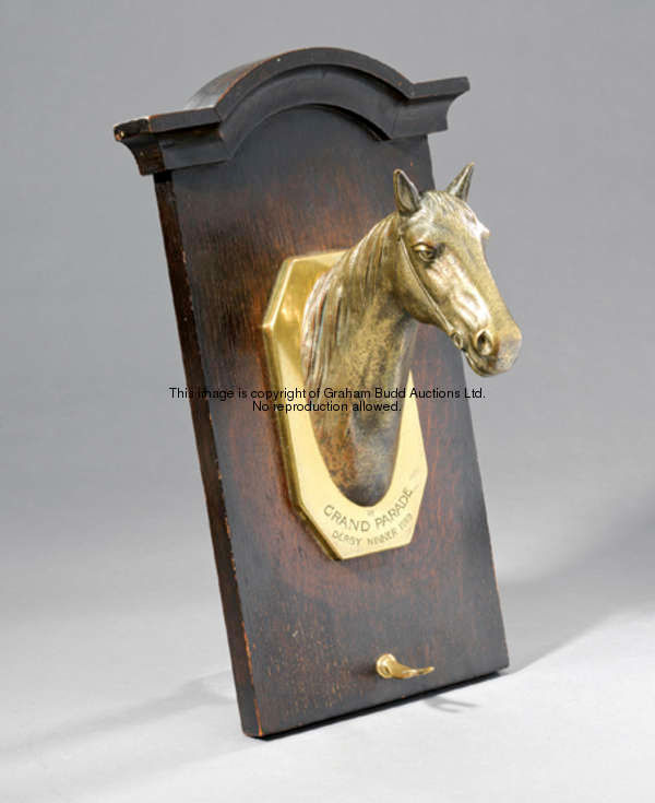 An unusual tack room wall-mounted hook featuring a head & neck sculpture of Grand Parade the 1919 De...