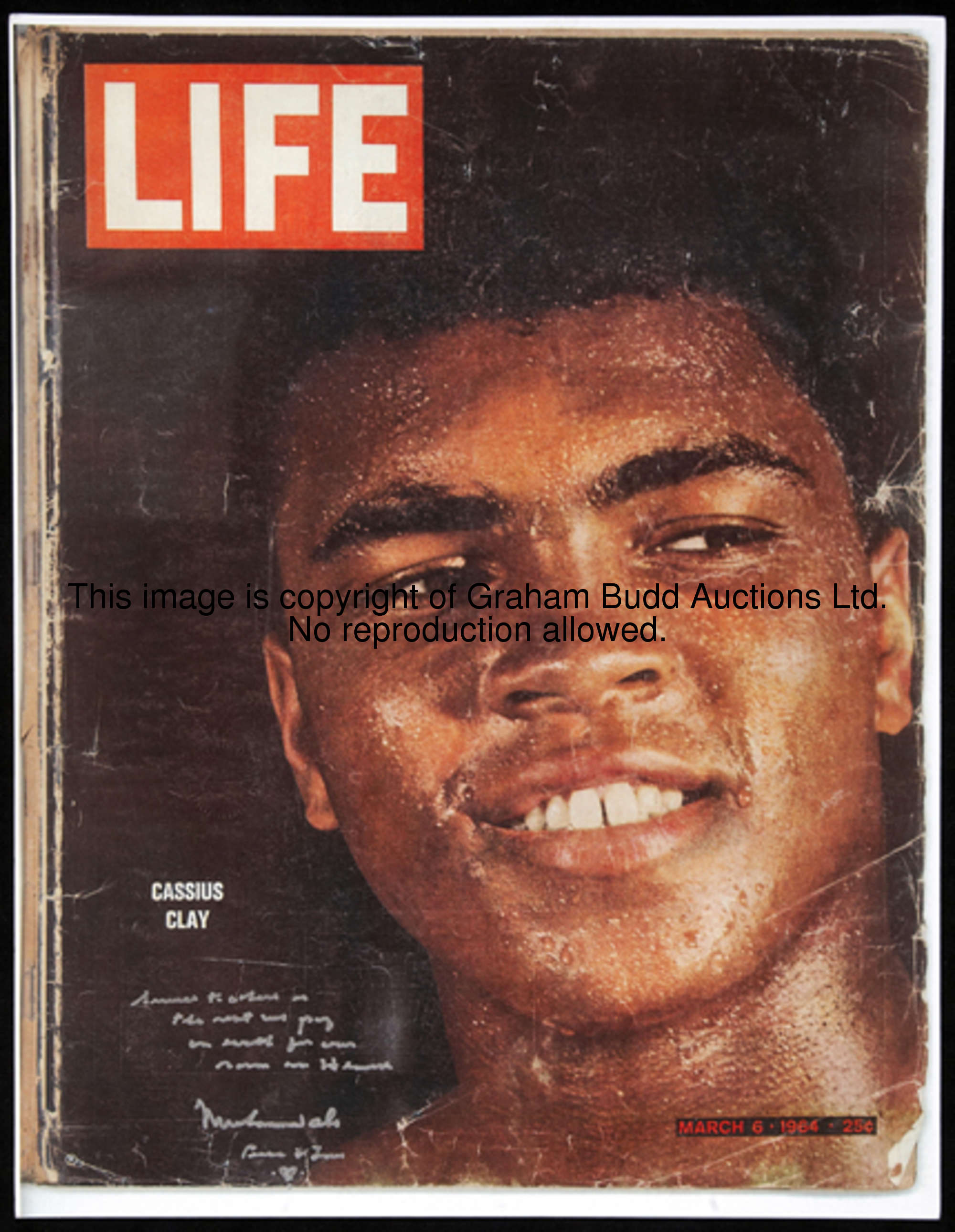 A Muhammad Ali signed reproduction of a 1964 Life magazine front cover, signature in silver marker p...