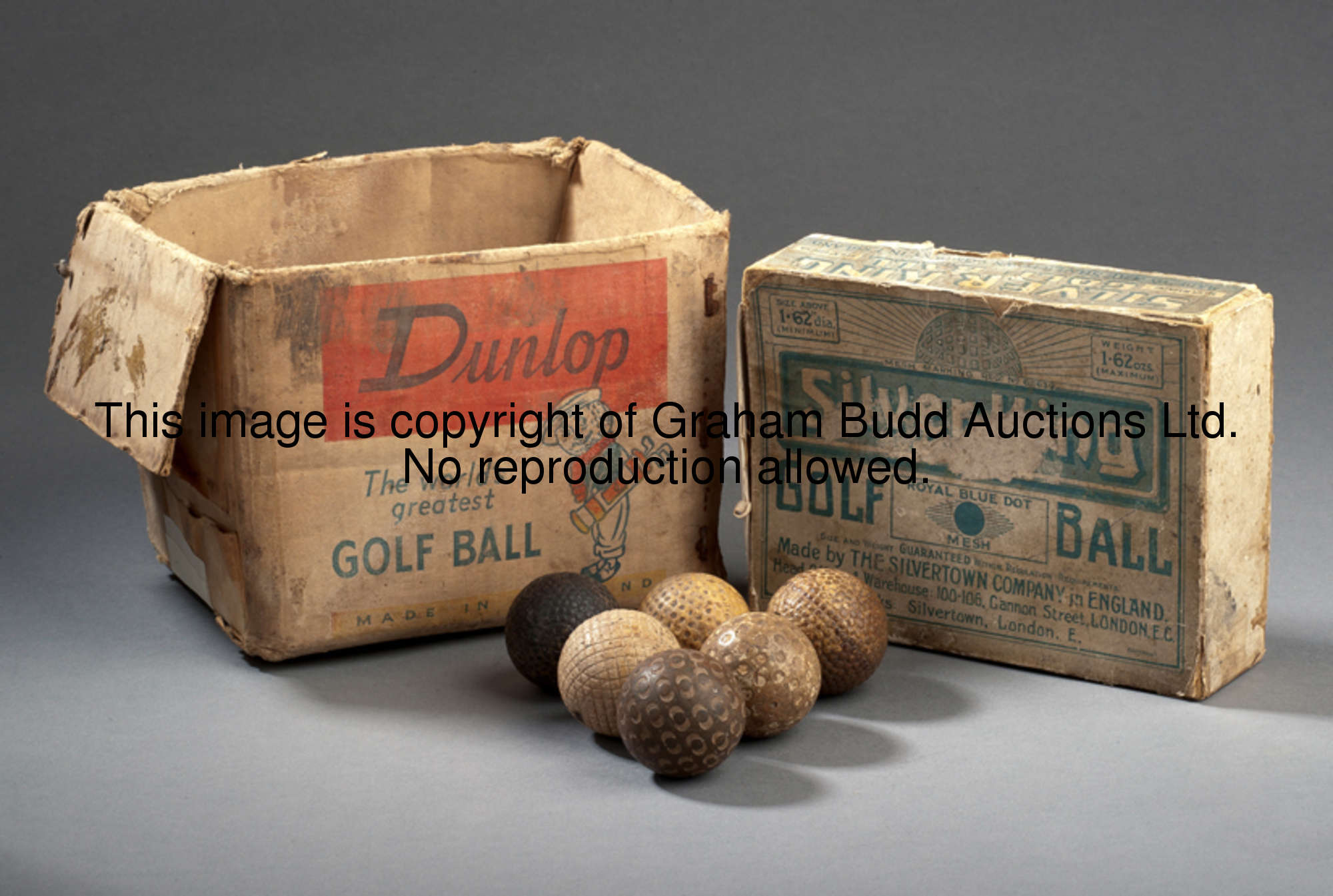 Six golf balls, comprising: a gutta percha ball circa 1900 and five rubber core balls, a Dunlop 31, ...