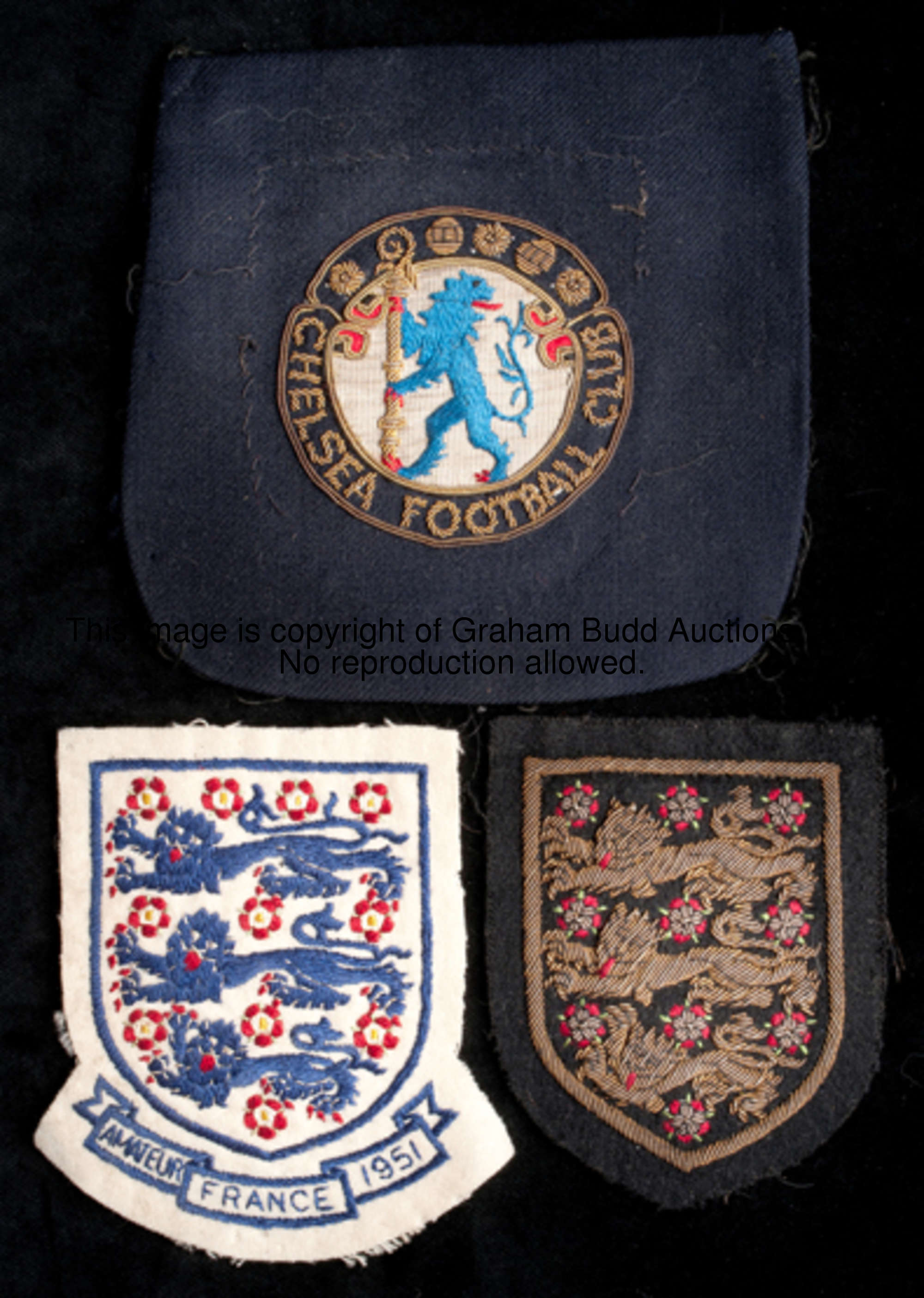 A trio of Jim Lewis cloth badges, a Chelsea Football Club blazer badge, an England Amateur Internati...