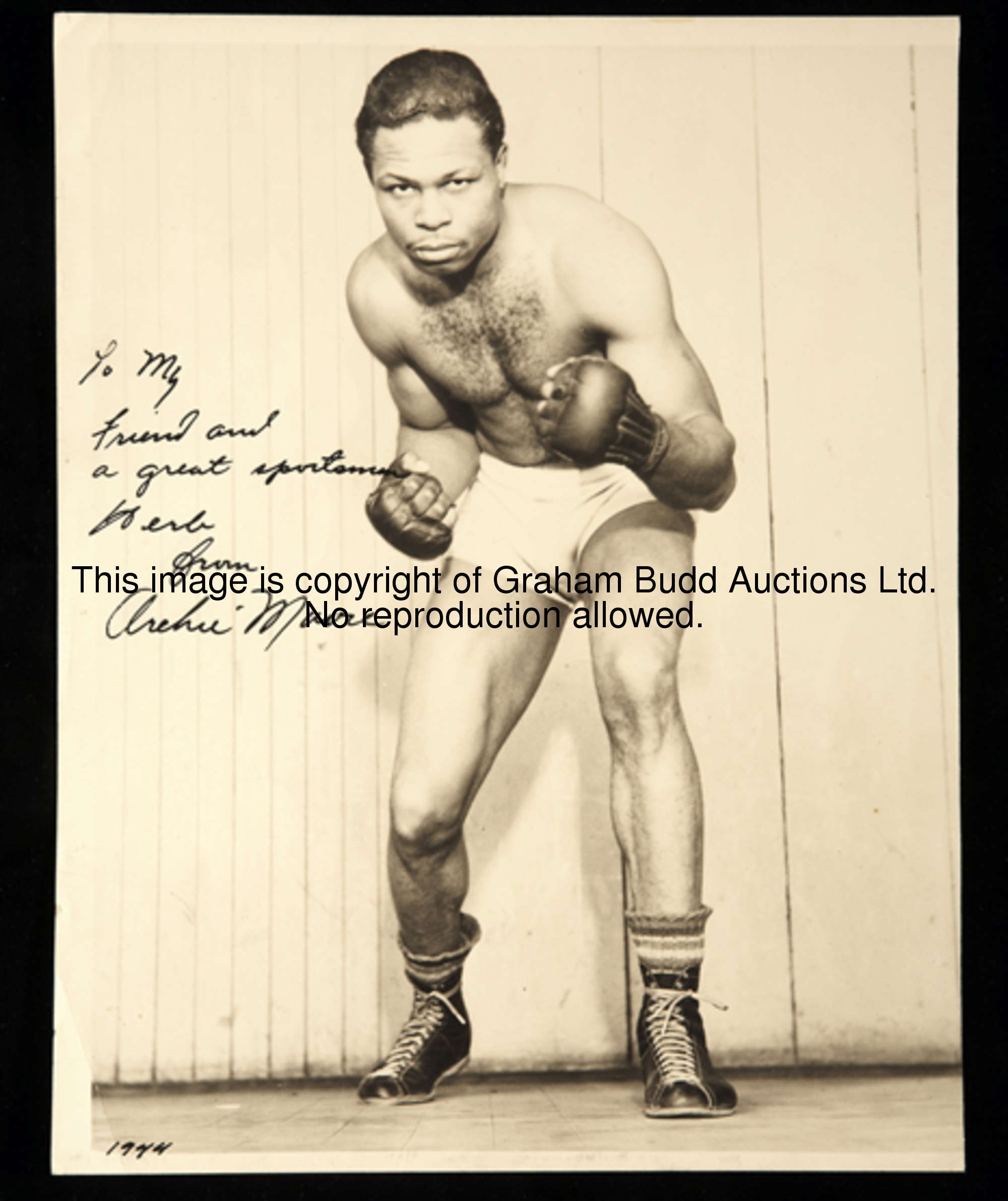 A portrait photograph signed by Archie Moore the American Light Heavyweight Champion Boxer of the Wo...