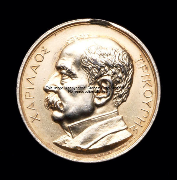 A Greek memorial medal to Charilaos Trikoupis dated 1896, in gilt with portrait to obverse  Charilao...