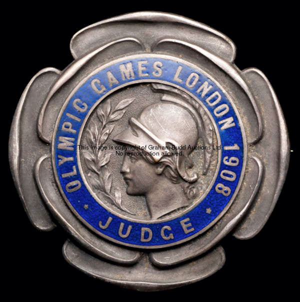 A 1908 London Olympic Games judge's badge, silvered bronze and blue enamel by Vaughton of Birmingham...