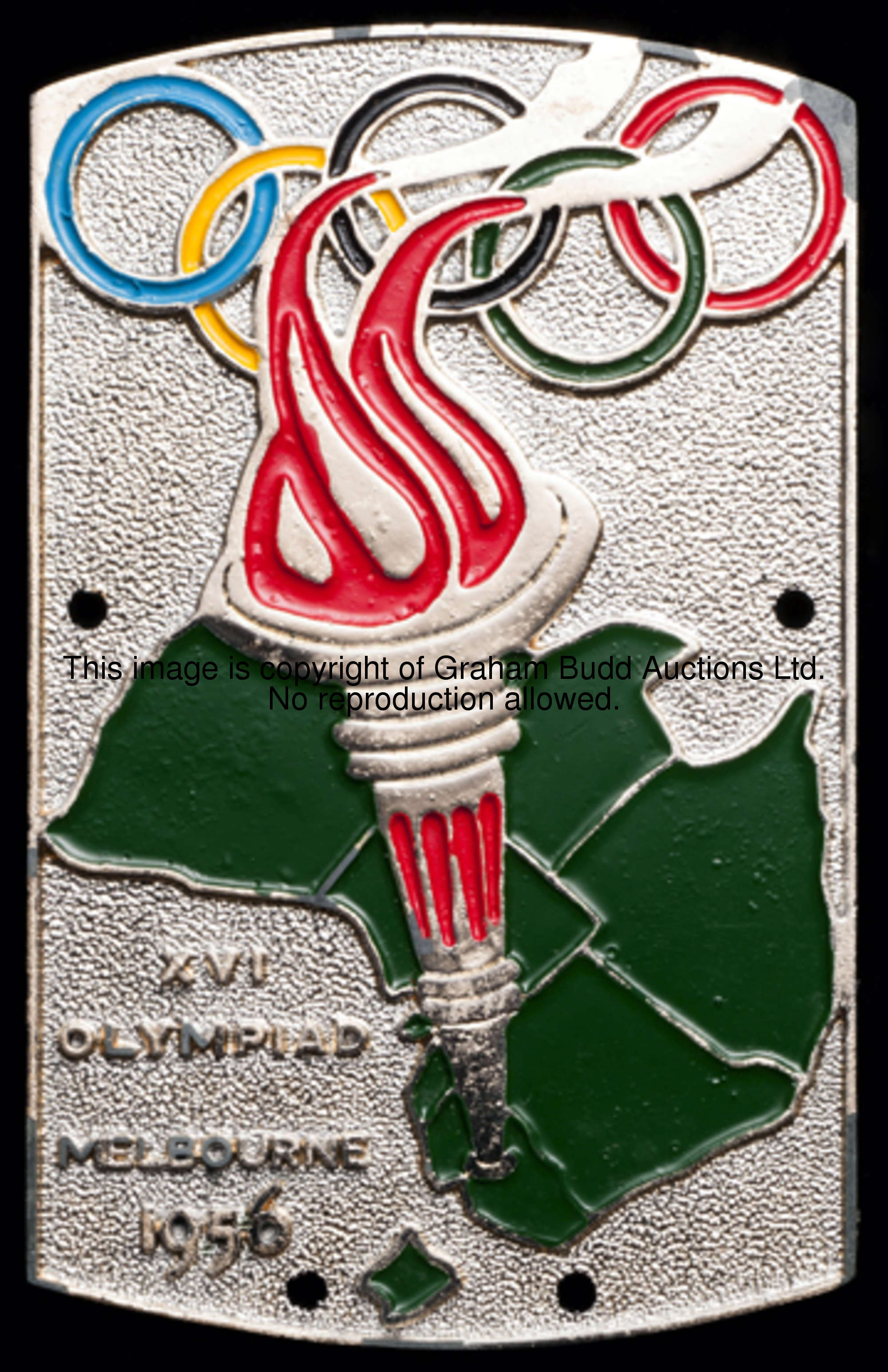 A car badge commemorating the 1956 Melbourne Olympic Games, silvered white metal & enamel by Streaml...