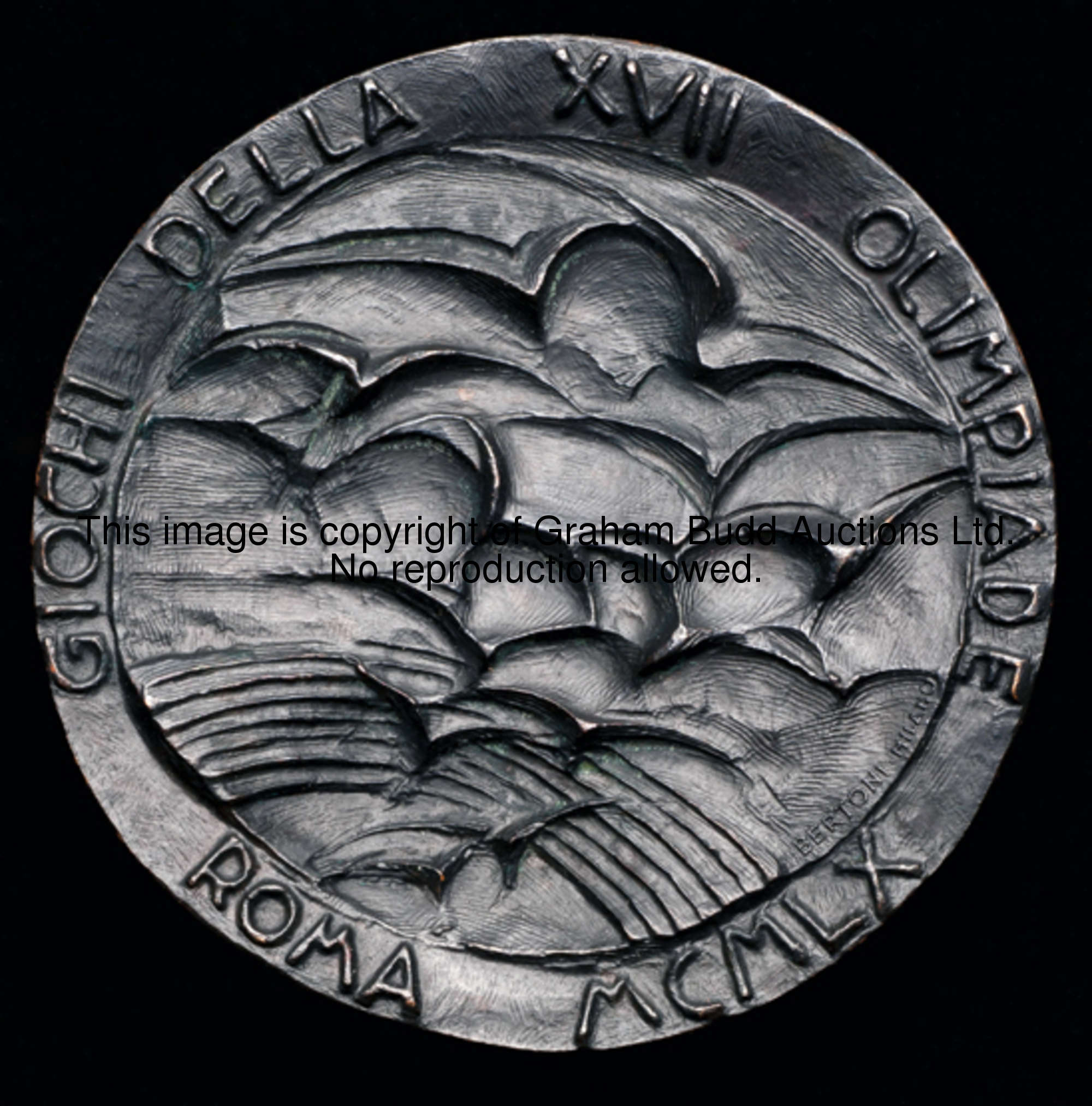 A 1960 Rome Olympic Games participation medal, designed by E Greco, nude female torch bearer over Ol...