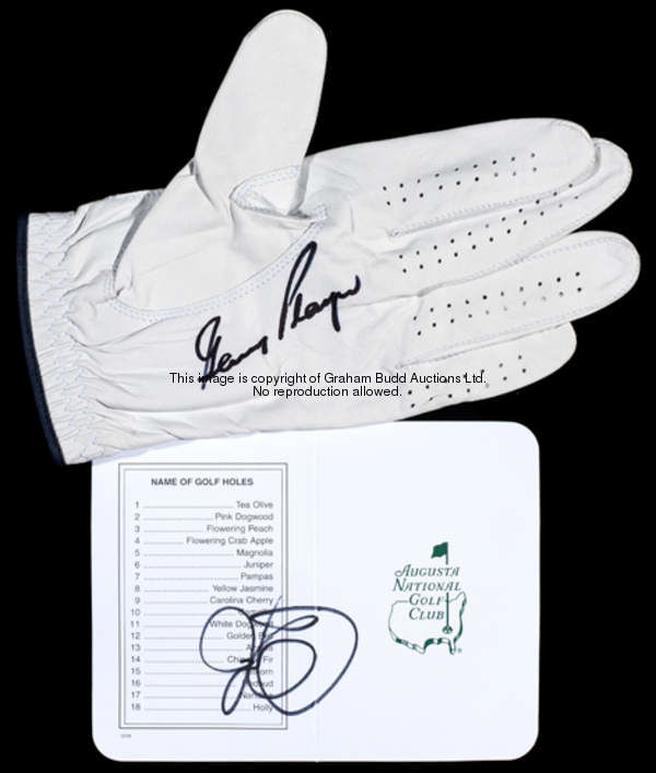 A Gary Player signed golf glove, Dunlop 65, signed in black marker pen; sold together with a Rory Mc...