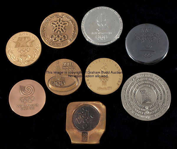 A collection of ten cased Olympic Games participation medals awarded to an IOC member, comprising: i...